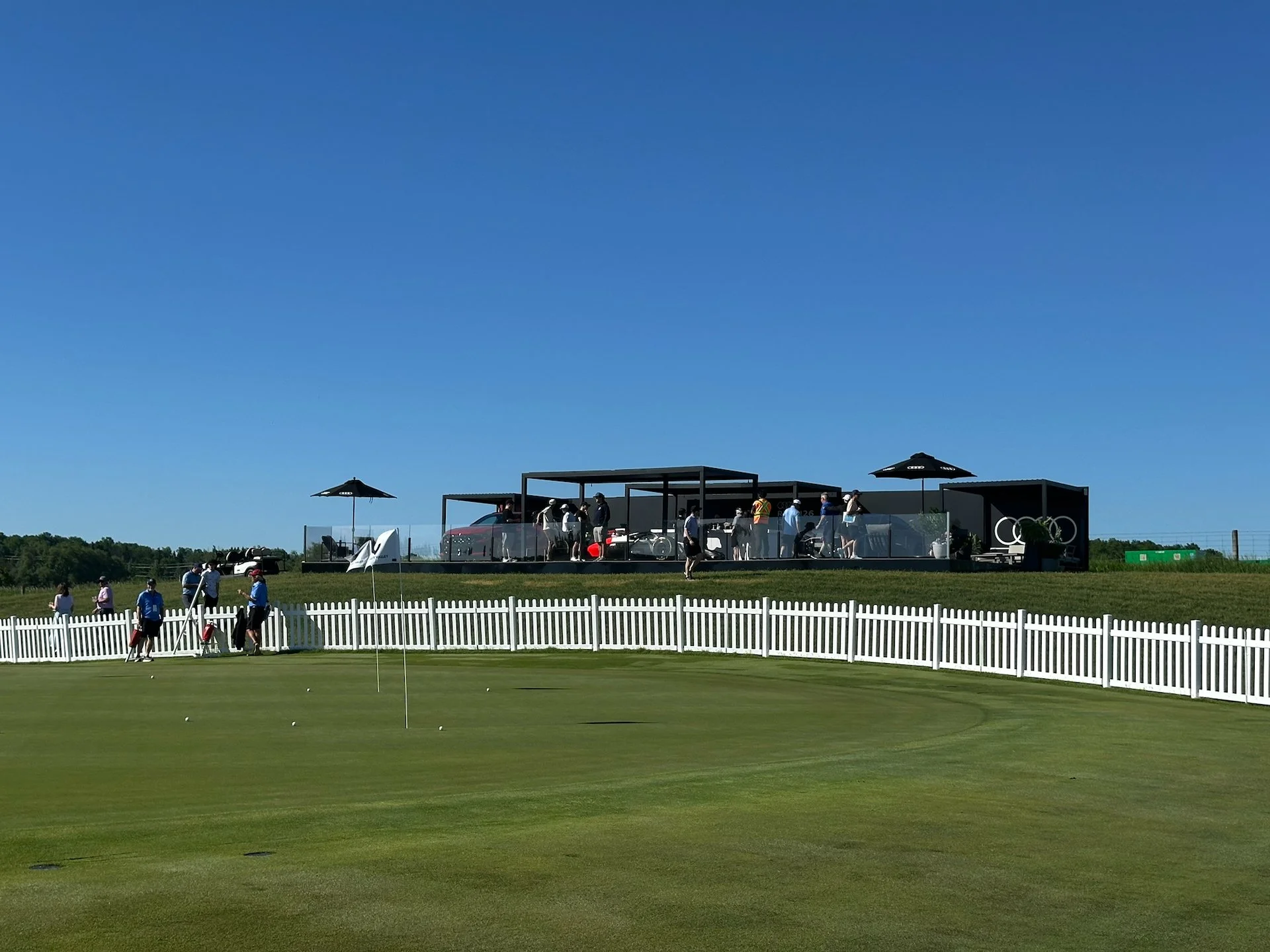  One of the chipping greens, with an Audi booth in the background. 