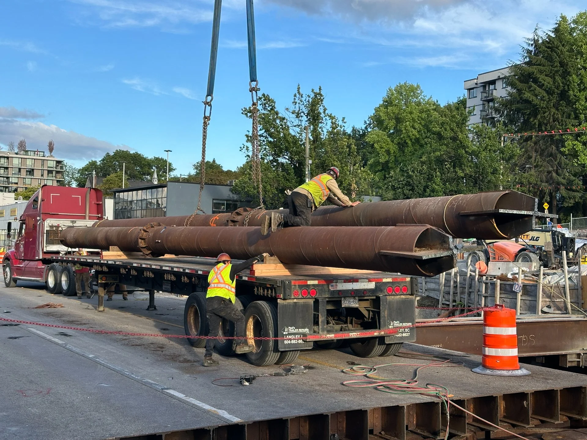  It was very interesting to watch as the crane dropped these massive beams onto the trucks.  