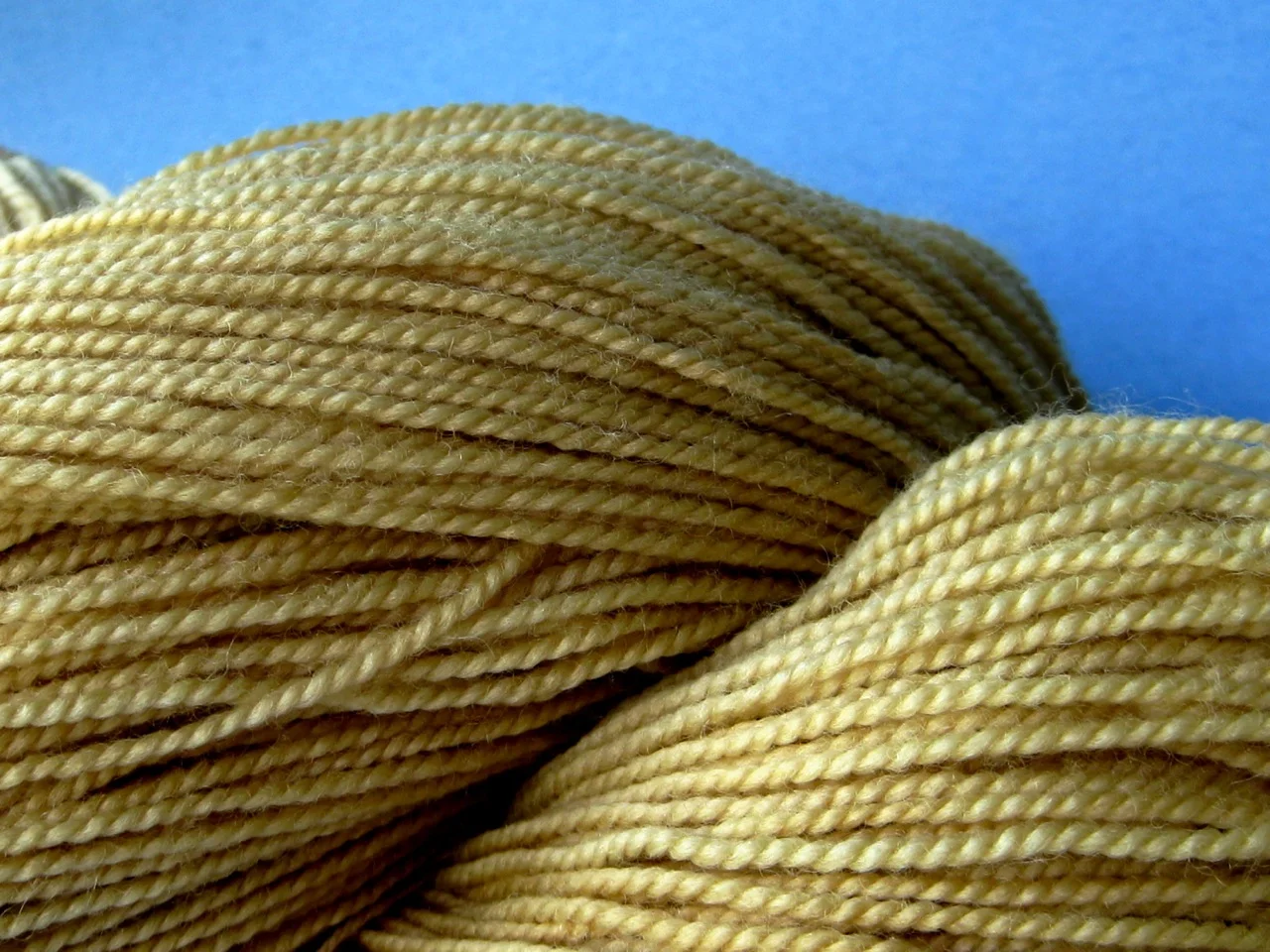 Wool yarn dyed with dried pomegranate rinds