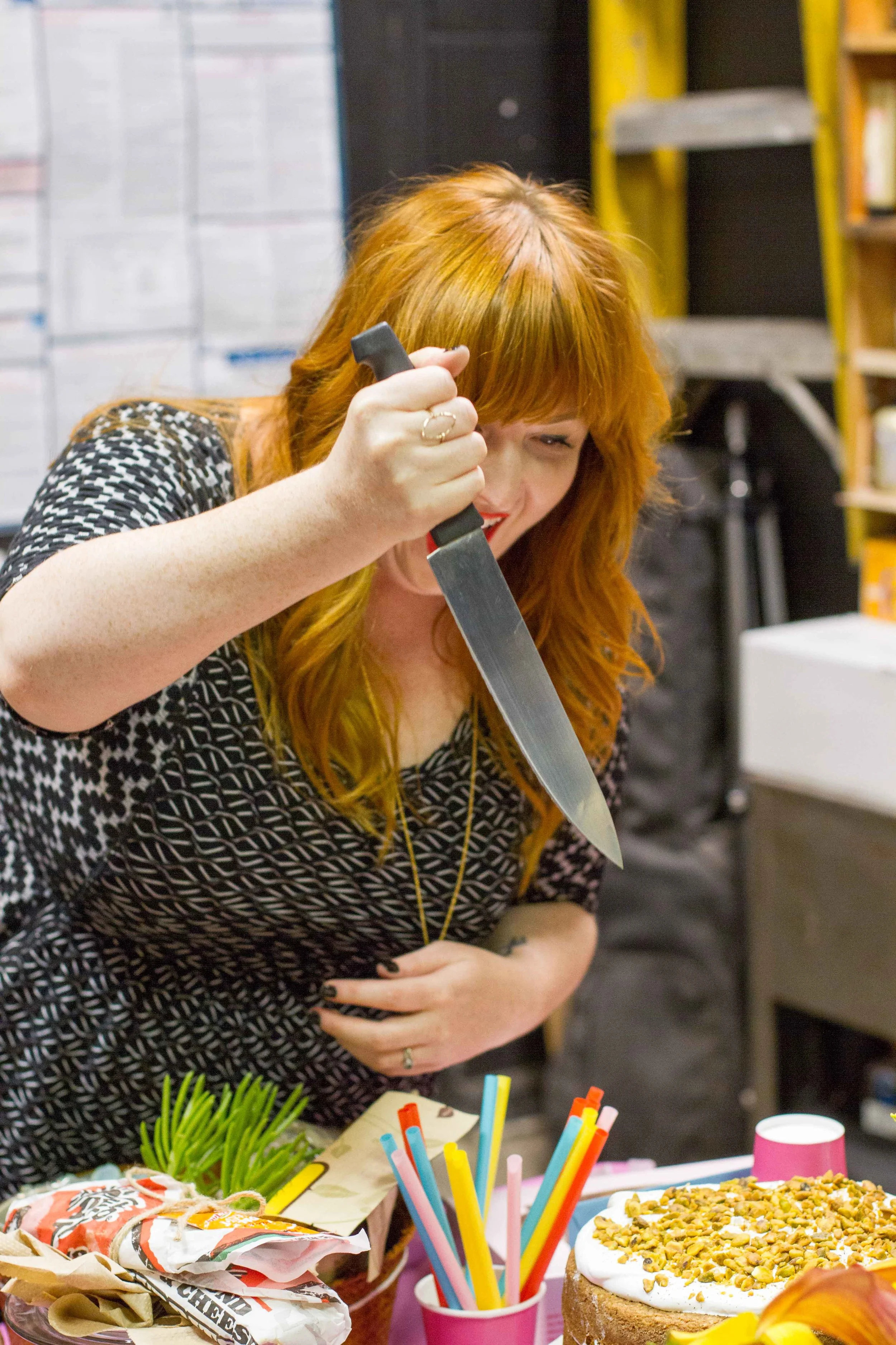 Lauren carrying out her ritual birthday cake sacrifice.