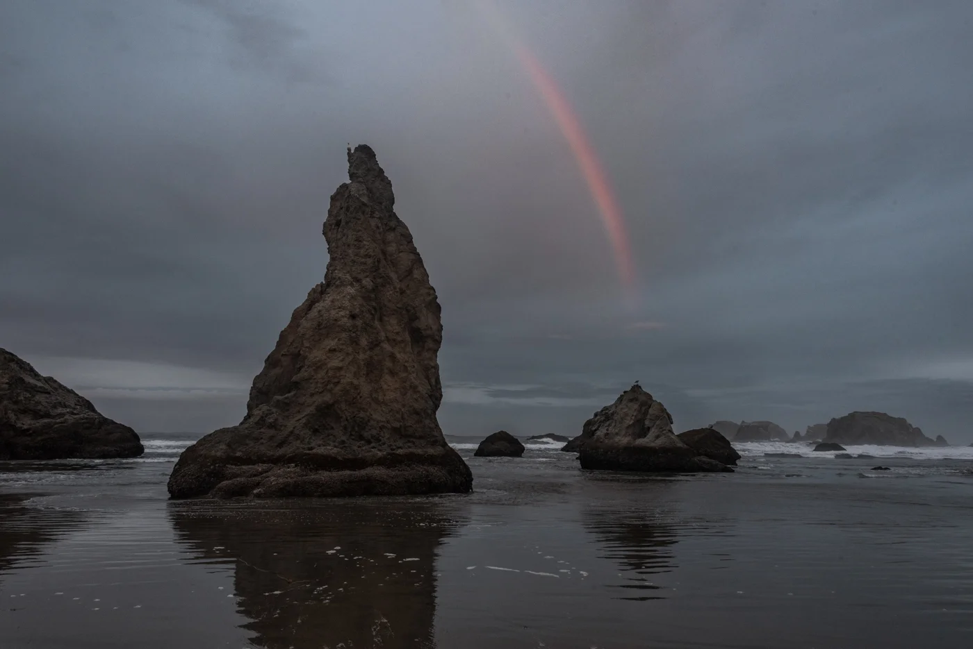 Misty Rainbow over sea stacks