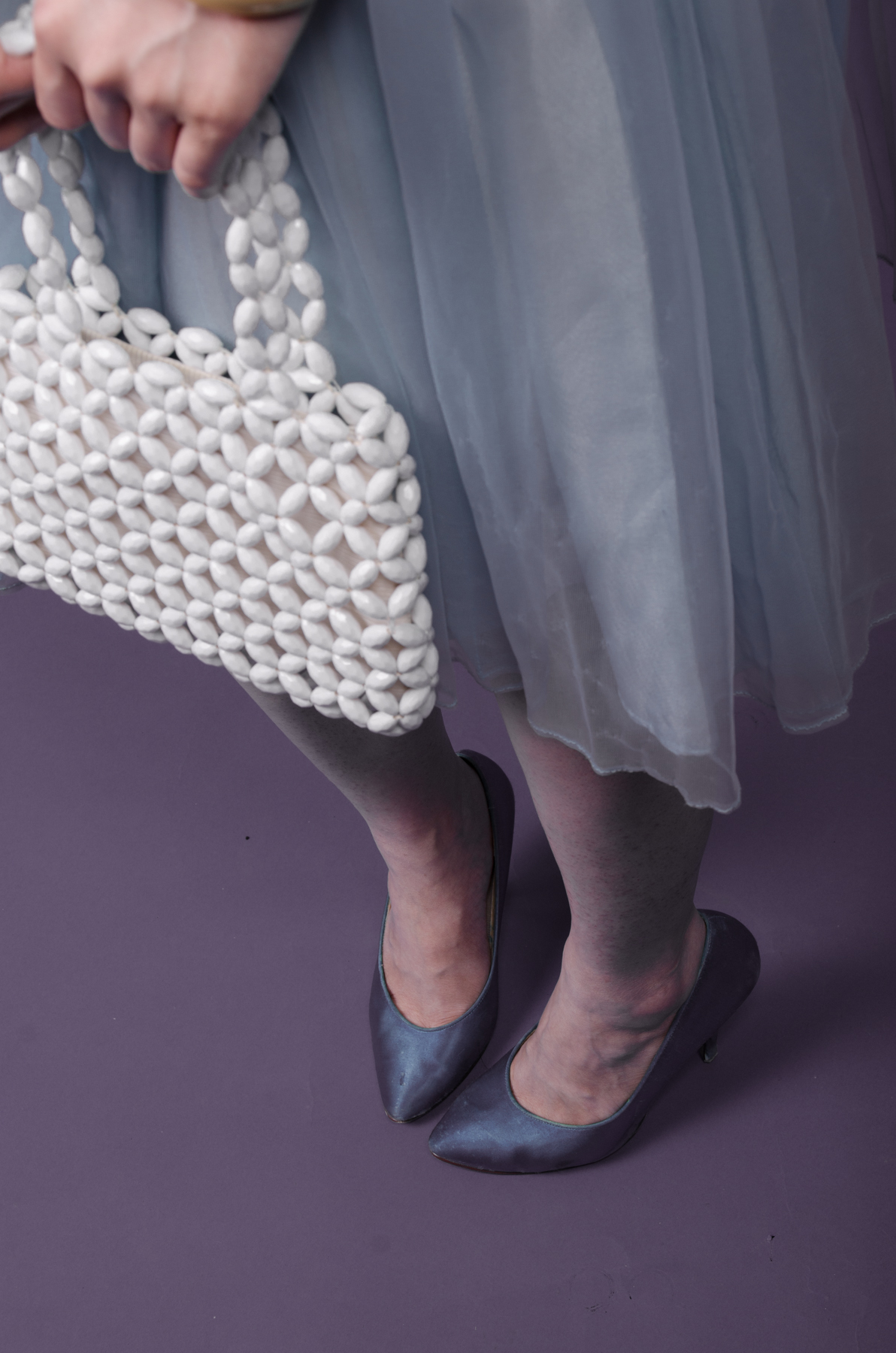 Jen is accessorized with an adorable beaded bag. 