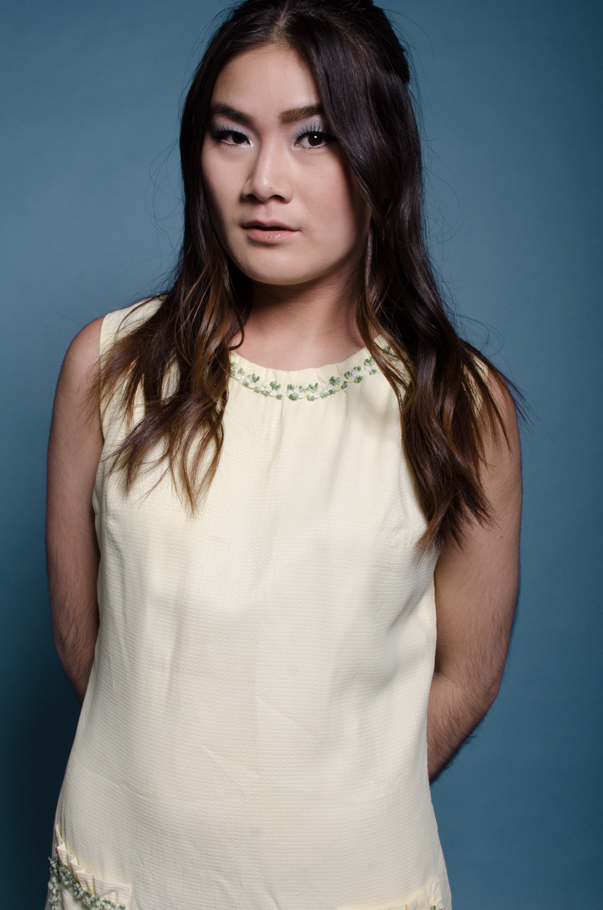 Jen is wearing a handmade 60s dress, in a butter yellow colour.