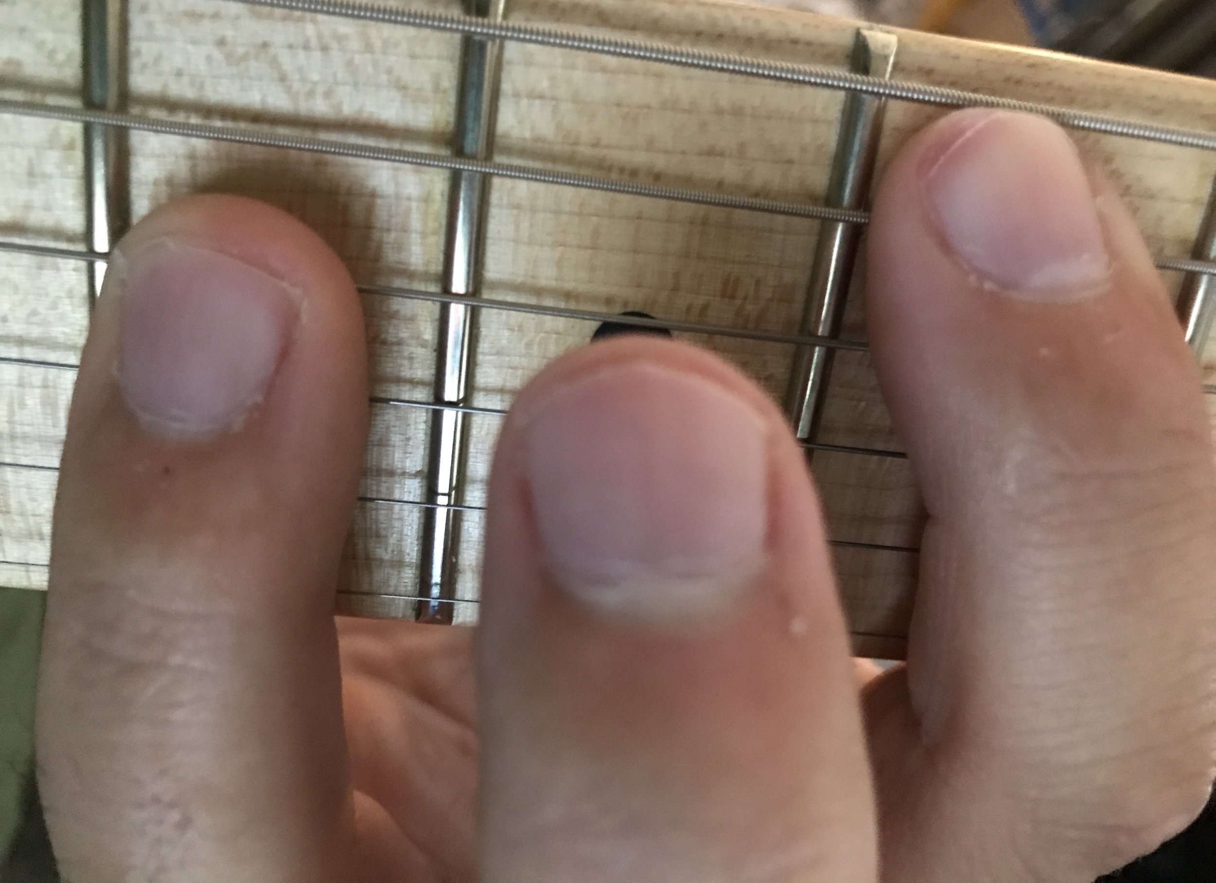 Use the tip of your index finger to mute the low E while playing chords on the A string.