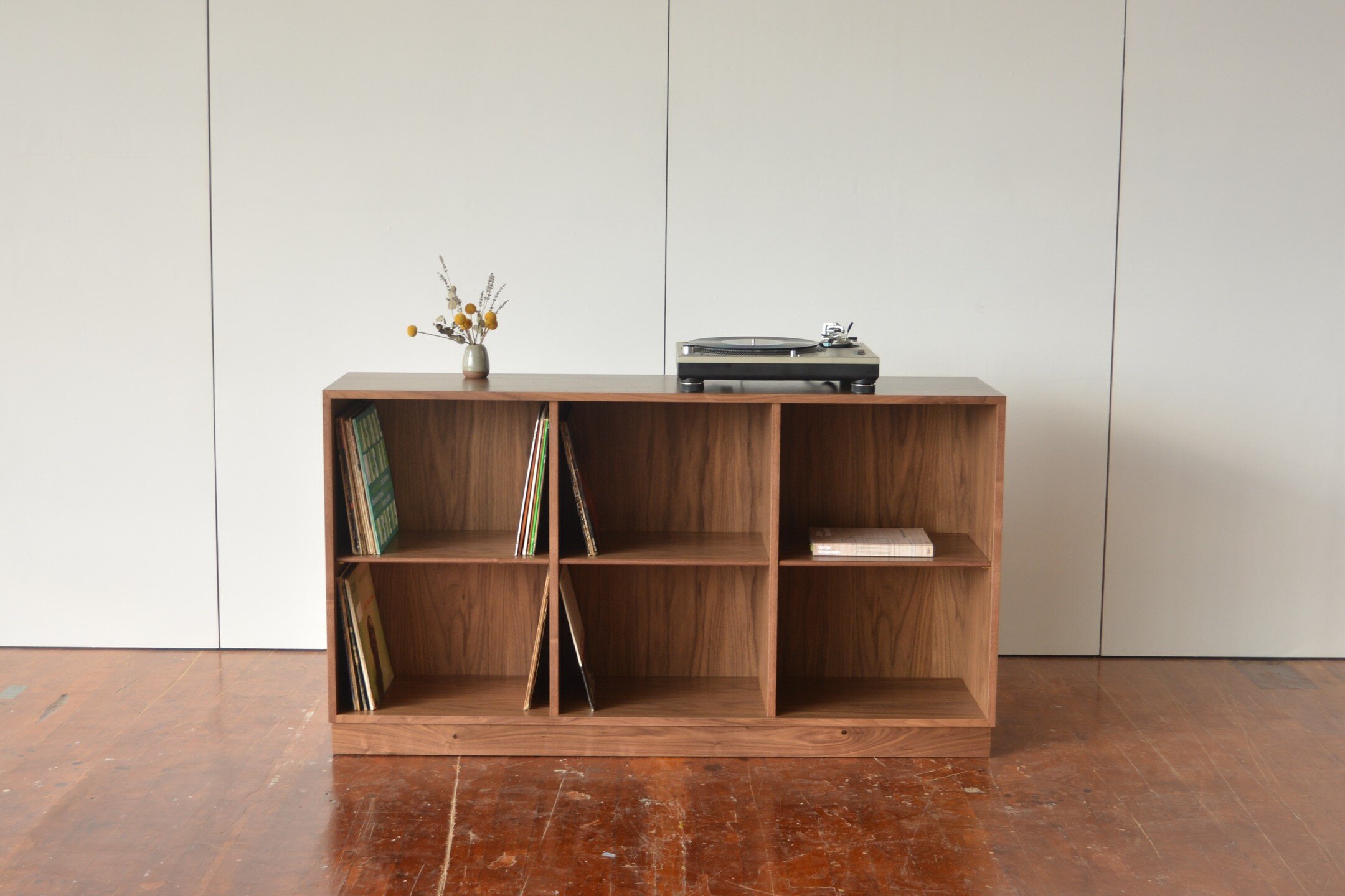 Low bookcase in walnut for @stokesfurniture. Sized for records or art books. 
This is built with shop seamed veneer over plywood with 1/2&quot; wide solid wood banding. The base is solid walnut with hidden adjustable feet.