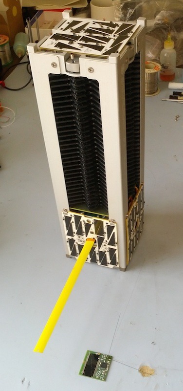 KickSat is a triple-sized (or 3U) CubeSat that acts as the mothership for hundreds of circuit-board-satellites called Sprites. (And it uses a tape measure too) Source: KickSat