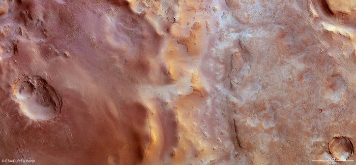 Carbon dioxide frost on the cratered floor of the Hellas Basin, itself a gigantic impact basin over 2,300 kilometers across. (Click on the image to see it full size or follow the link for Esa's detailed explanation.) Source: Esa/DLR/FU University