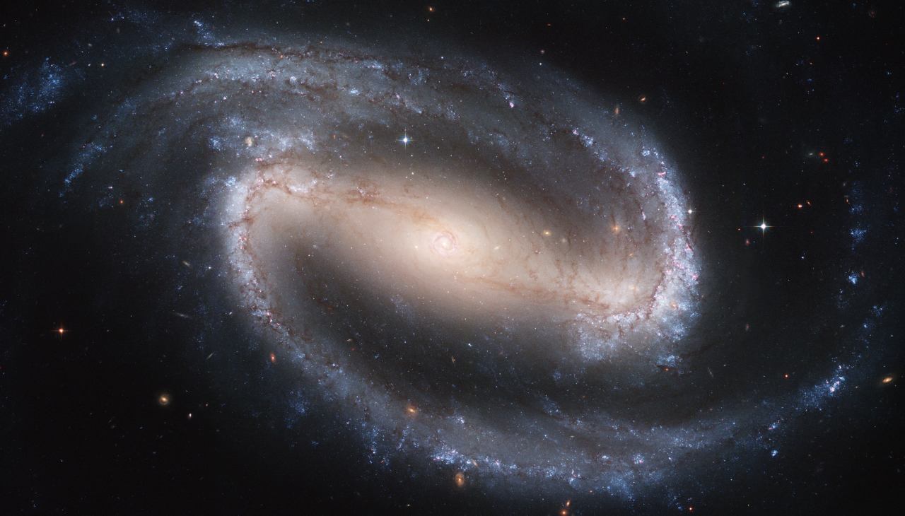 NGC1300 is a barred spiral galaxy. A galaxy's bars may channel gas, dust, and star systems into the galaxy's central black hole, sending massive jets of ionized matter from the black hole's core. (Click on the image to see it full size or follow the link for more information about NGC1300) Credit: Nasa, Esa, and The Hubble Heritage Team STScI/Aura