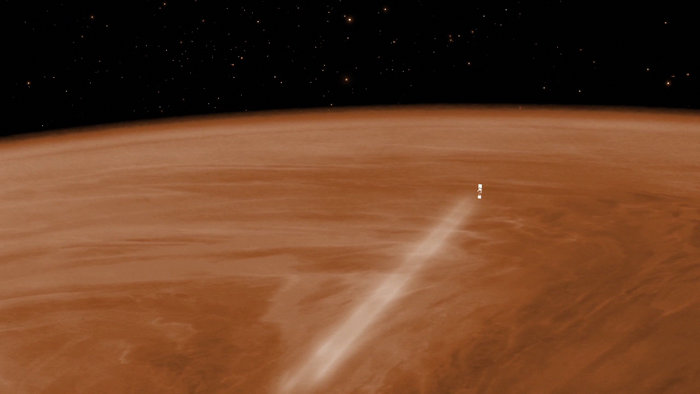An artist's concept of Venus Express passing through the planet's atmosphere. Credit: Esa, C. Carreau