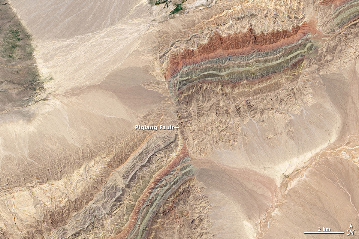 This is my favorite for the finals in Nasa's Earth Observatory Tournament Earth ( link ) It shows a fault line in the hills of China's Xinjiang province. Credit: USGS/Robert Simmon and Jesse Allen