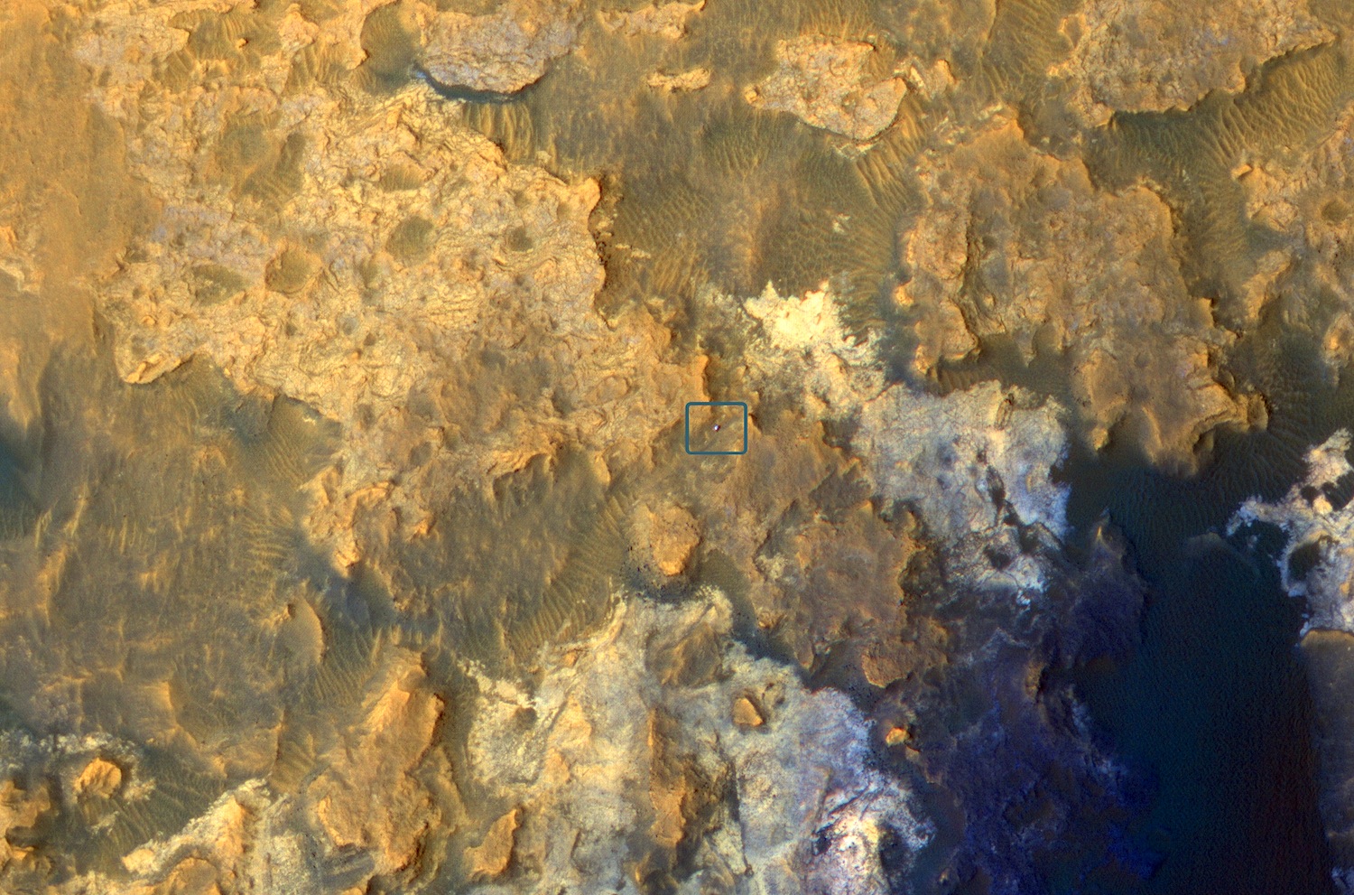 The Mars Reconnaissance Orbiter snapped this picture of Curiosity (in the blue box at center) roving through a valley on the slopes of Mount Sharp. Credit: Nasa/JPL-Caltech/University of Arizona