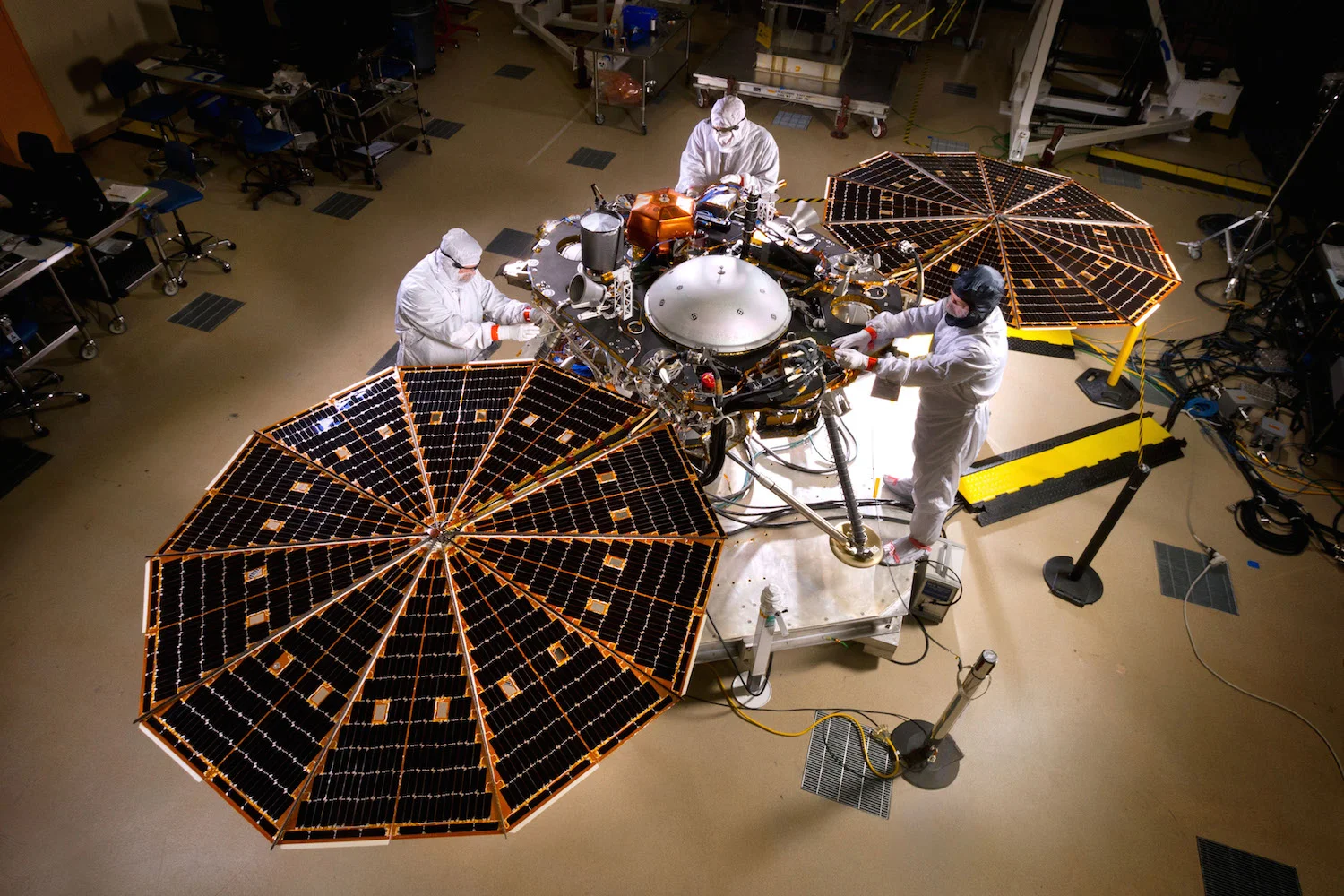 The great thing about being a Lockheed Martin engineer? Mood lighting. Based on a platform developed for the successful Pheonix mission, Nasa's Insight mission will explore the interior of Mars. Credit: Nasa/JPL-Caltech/Lockheed Martin