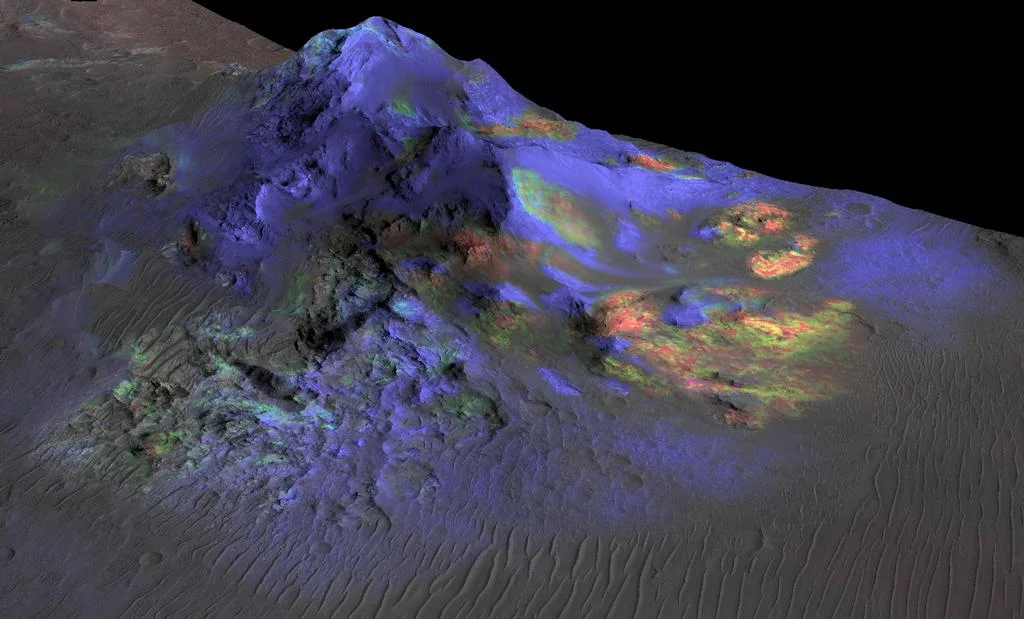 The green splotches in this Nasa image indicates the presence of glass deposits in the central peak of Alga Crater. The image combines topographical data (grey) from the HiRise camera and spectral data (color) from the Crism instrument on Nasa's Mars Reconnaissance Orbiter. Credit: Nasa/JPL-Caltech/JHUAPL/University of Arizona