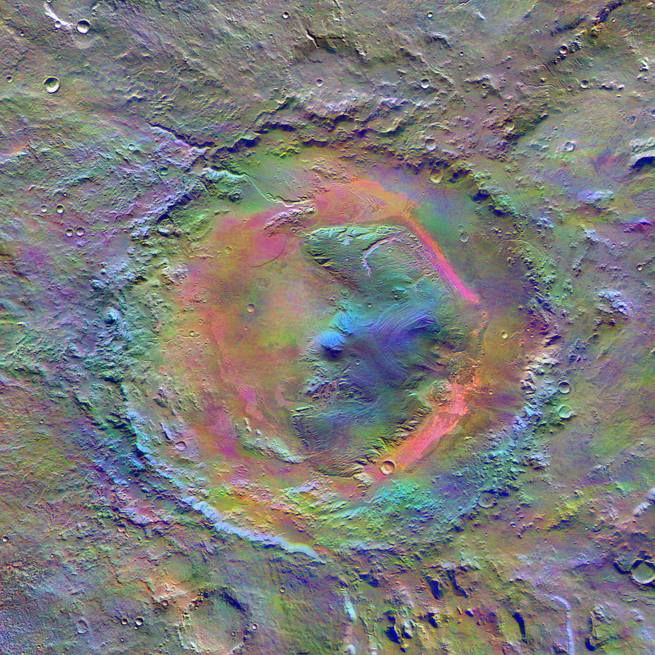 Mars Odyssey's view of Gale Crater. The enhanced color image from the Themis camera shows the distribution of minerals on the surface. The pink shading is wind-blown dust that partially covers basalt (purple) created during the asteroid impact. The bluish regions at the peak of Aeolis Mons (Mount Sharp) may be a different mineral that Curiosity may identify later in its journey. Credit: Nasa/JPL-Caltech/Arizona State University