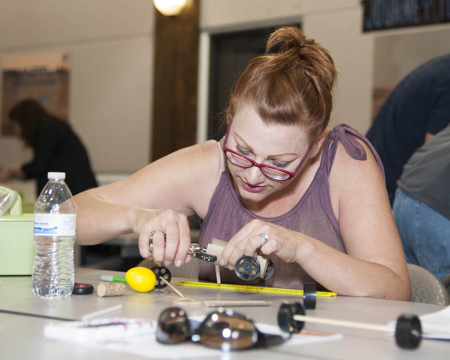 An educator learns how a "rover" build can enhance science classes. Credit: NASA Photo/Lauren Hughes