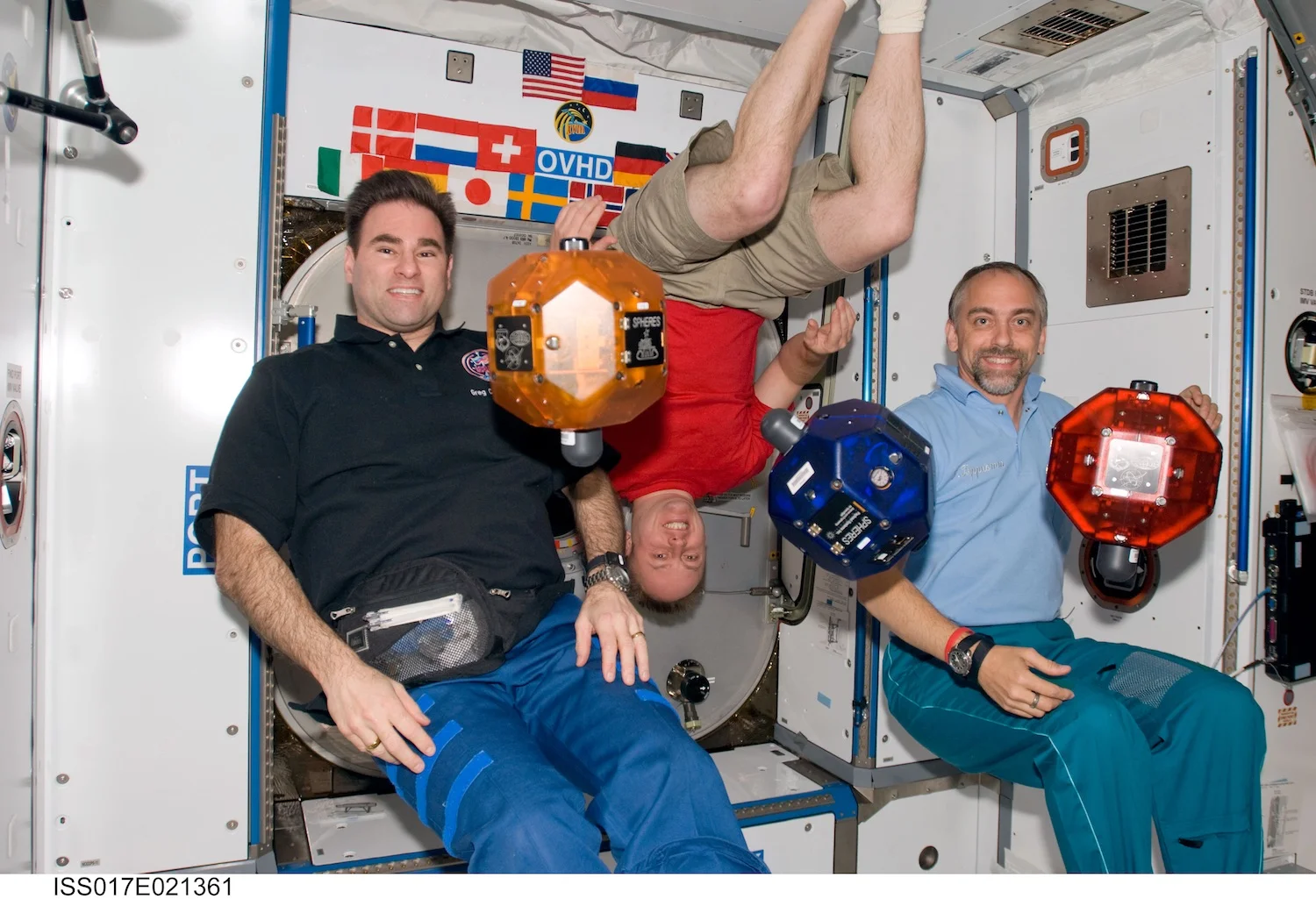 Astronauts pose with the Spheres robots on the International Space Station. Credit: Nasa