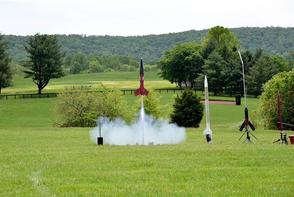 A rocket lifts off from a Virginia pasture at last year's Team America Rocketry Challenge. Thousands of kids competed to enter this year's contest and a shot at representing the United States in world competition. Source: Team America Rocketry Challenge