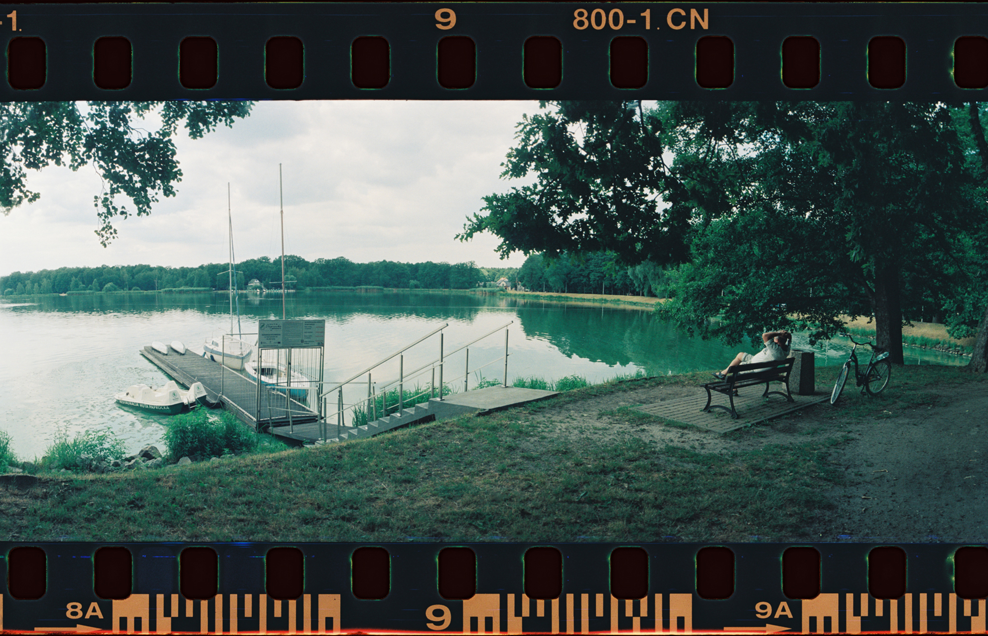  I like the composition here but could be a bit closer. Will need to really do a test to see how much extra you get around the shot with this camera.  I like how the boats are framed between the trees and also like the relaxed guy there. 