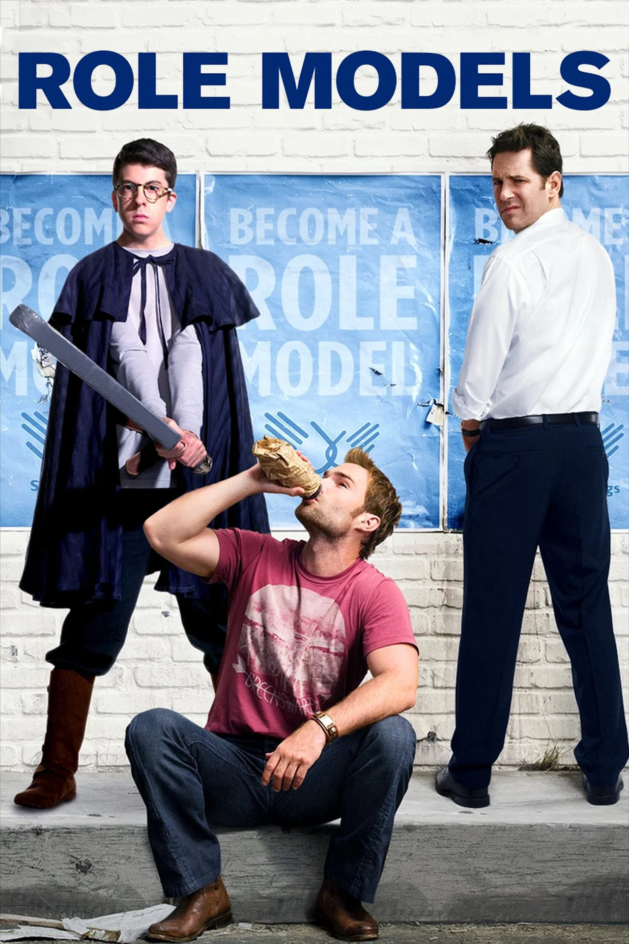 Three men are depicted in front of a blue banner that reads 'Become a Role Model'. One man is sitting on the ground drinking from a paper bag, another man is standing in a costume resembling a medieval knight with a sword, and the third man is in a white shirt with his hands in his pockets, looking at the camera with a puzzled expression.