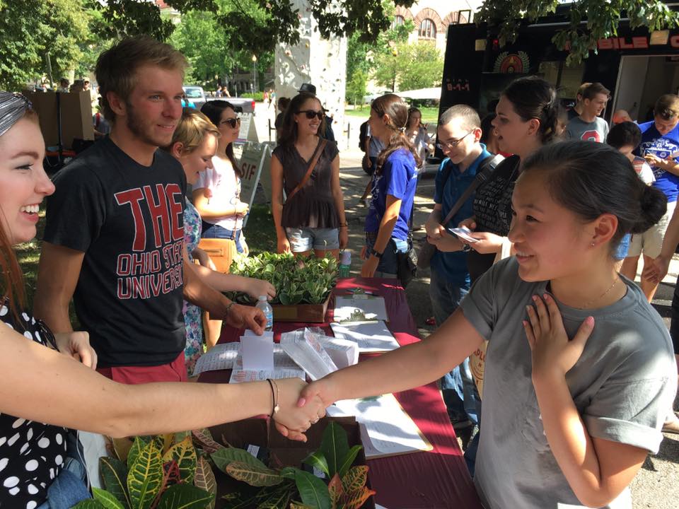 SPO students hand out plants during the involvement fair