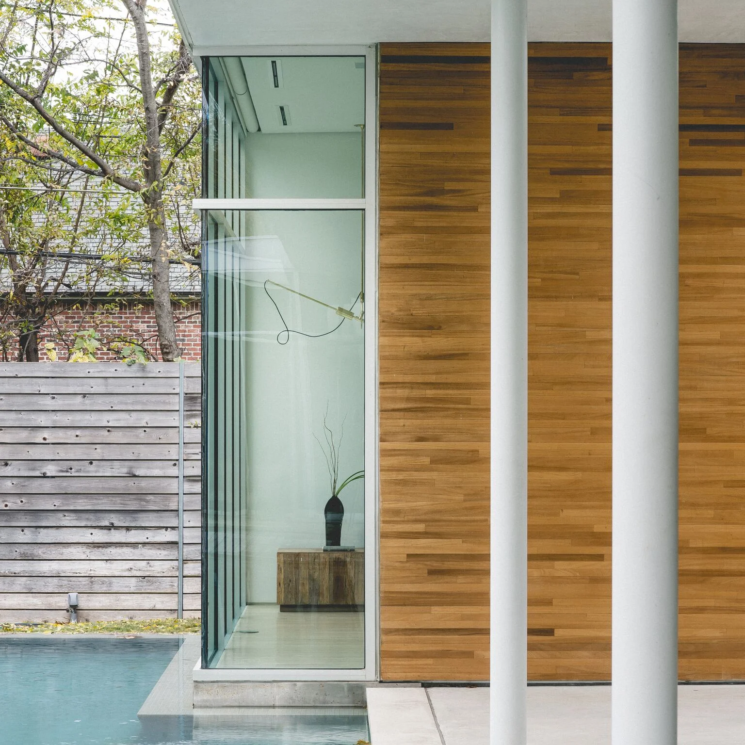 bedroom peeks over water:  mahogany / leuders limestone