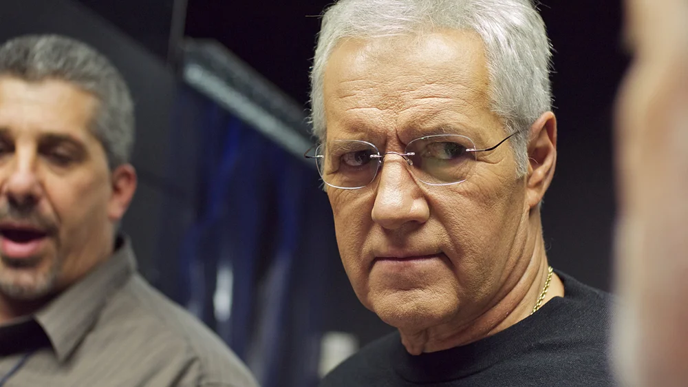 JEOPARDY! host Alex Trebek takes a tour of the WATSON computing system server room prior to the championship match.