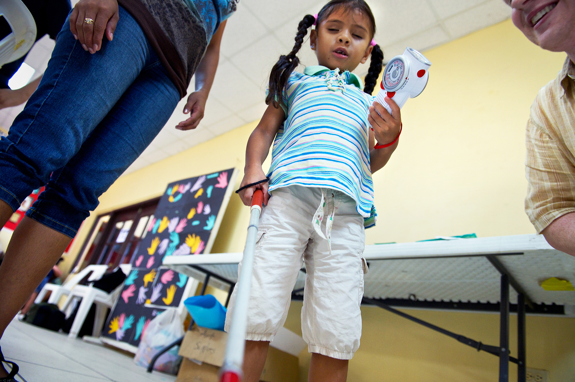 BCVI Summer Camp attendee Brittany Monterosa receives a self-powered radio.