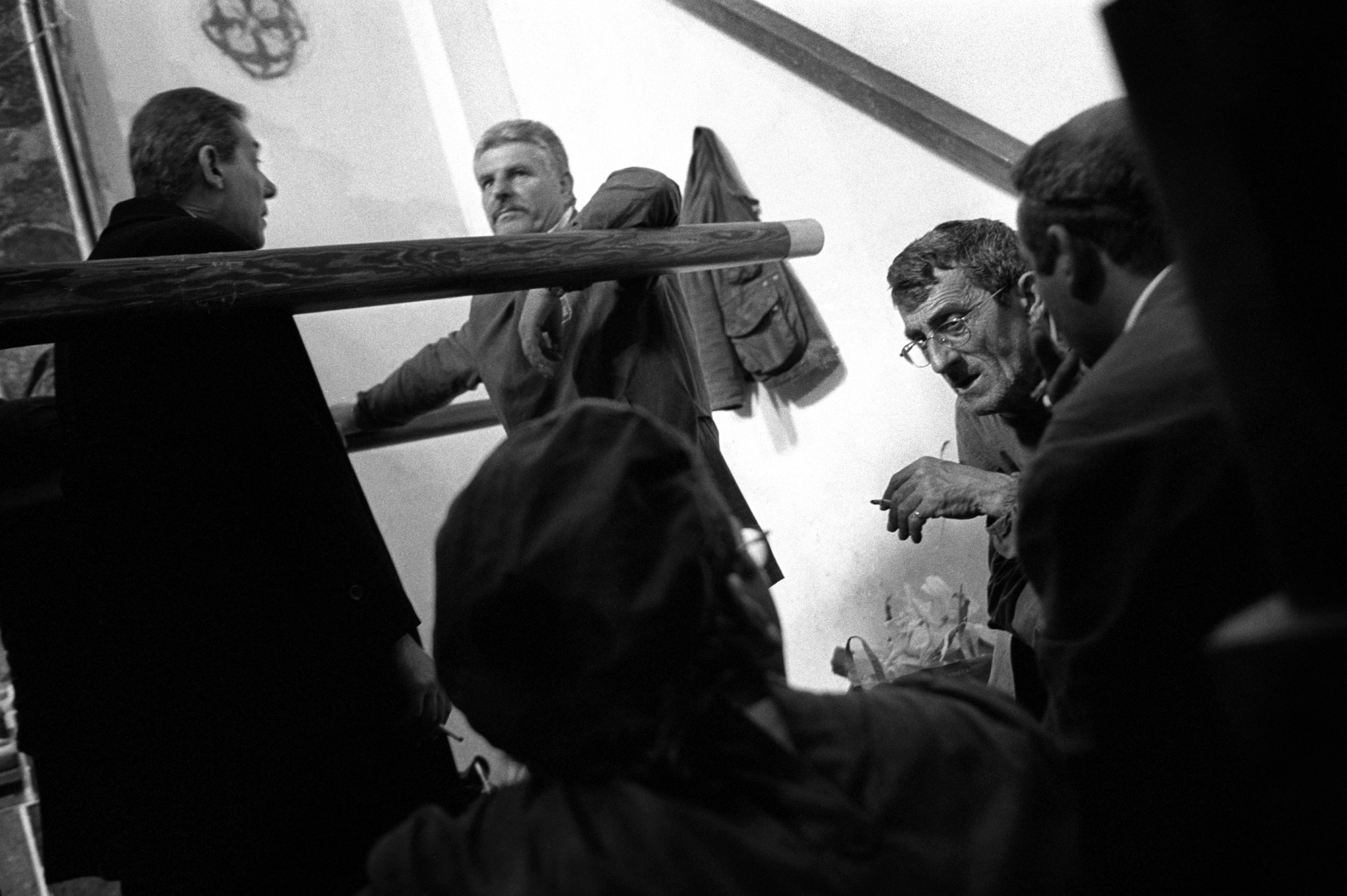 Tradesmen relax in a chapel after depositing their processionals. Erice, Sicily.