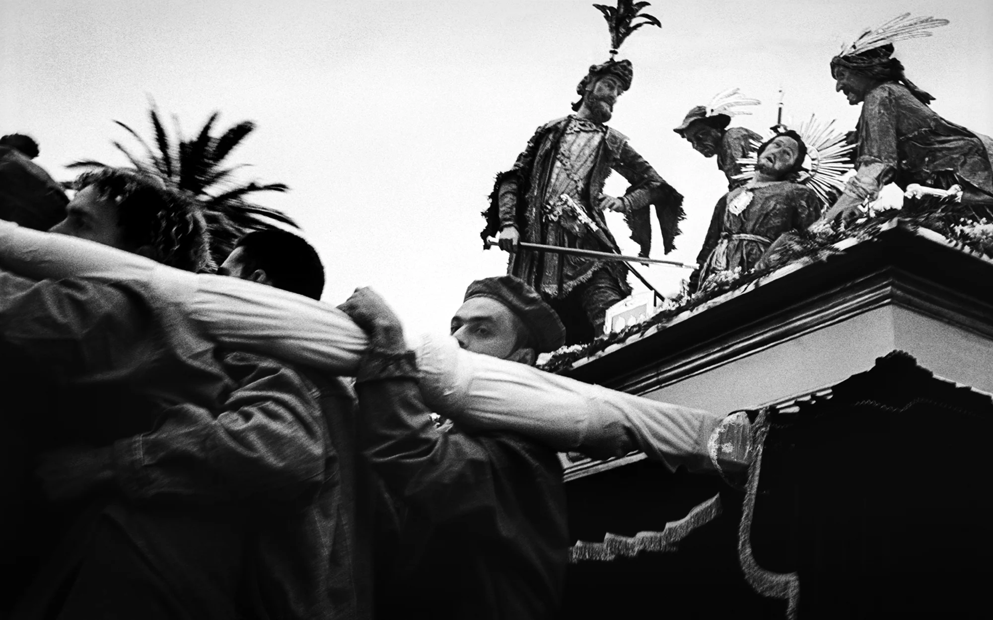Huge processionals are hoisted through the streets and staged in churchs by men of every station.