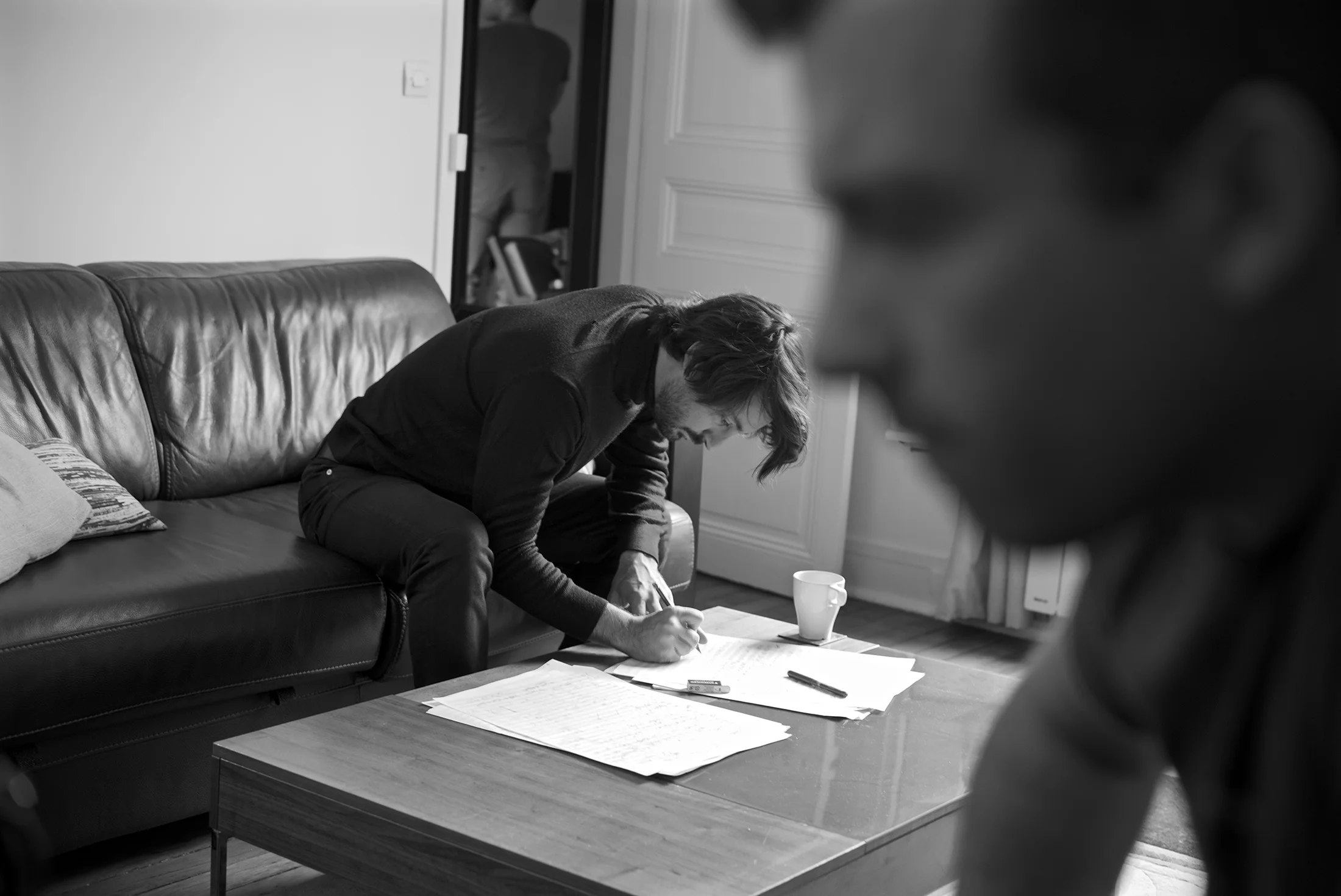 The composer Mathieu Lamboley prepares a manuscript. Paris, France.