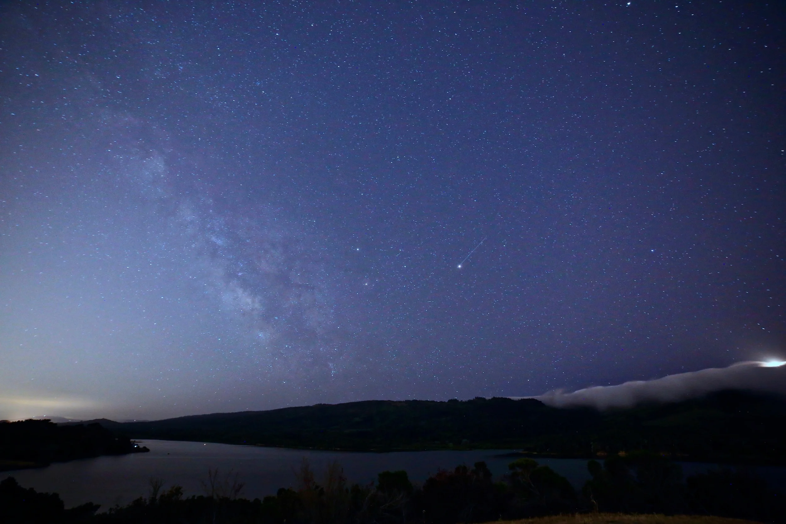 First decent Milky Way. That's Crystal Springs Reservoir which marks the San Andreas fault line. The fog was politely waiting on the hills. The plane emerging from that fog in the far right of the photo was pretty surreal. This is barely out of the city, so pretty surprising that you can see this at all.