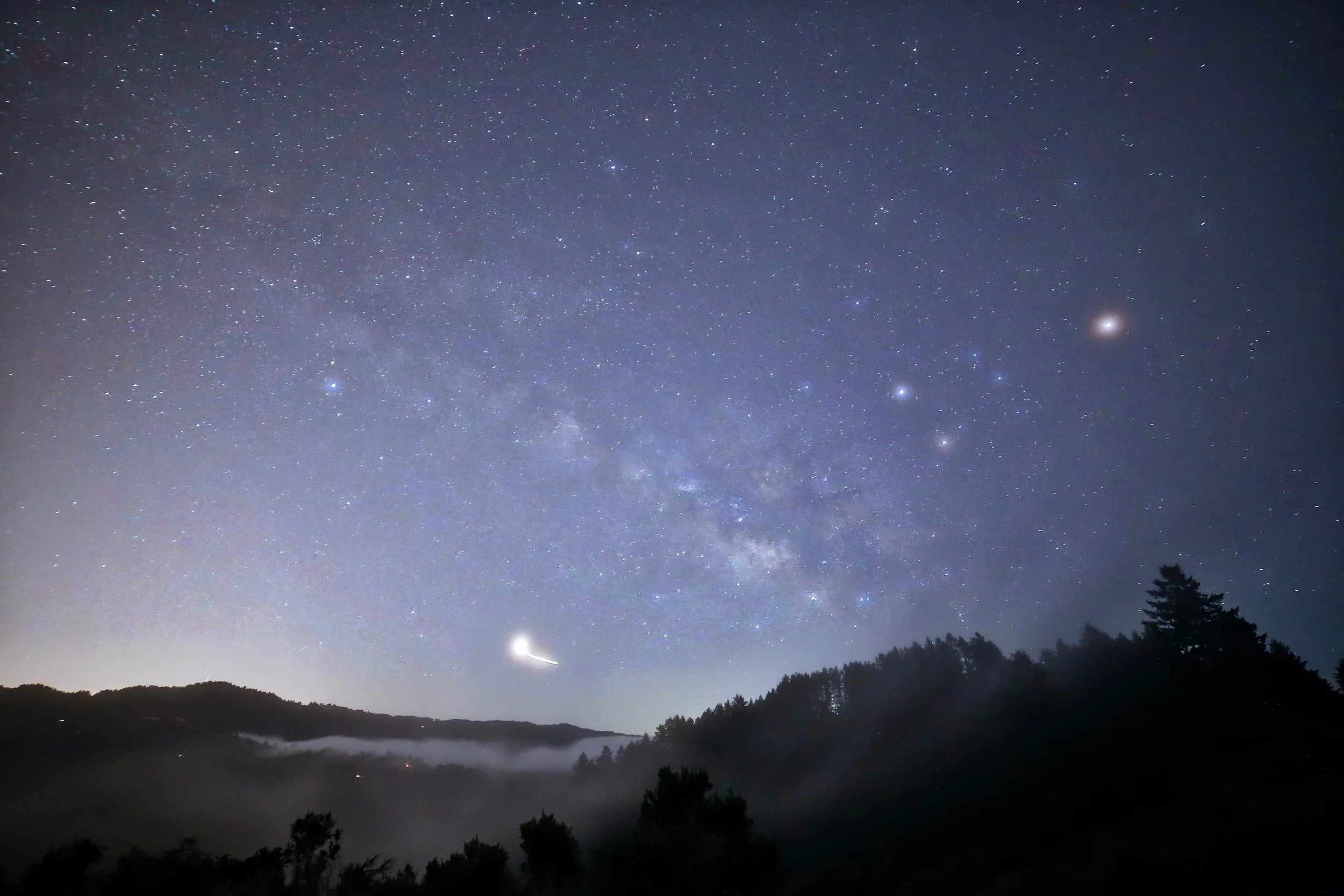But then the fog started to fill the small valley below me and splash up over the side in front of me giving all the stars a fuzzy glow. I was pretty upset and thought, oh well, that's over, might as well turn the camera and get some trails.