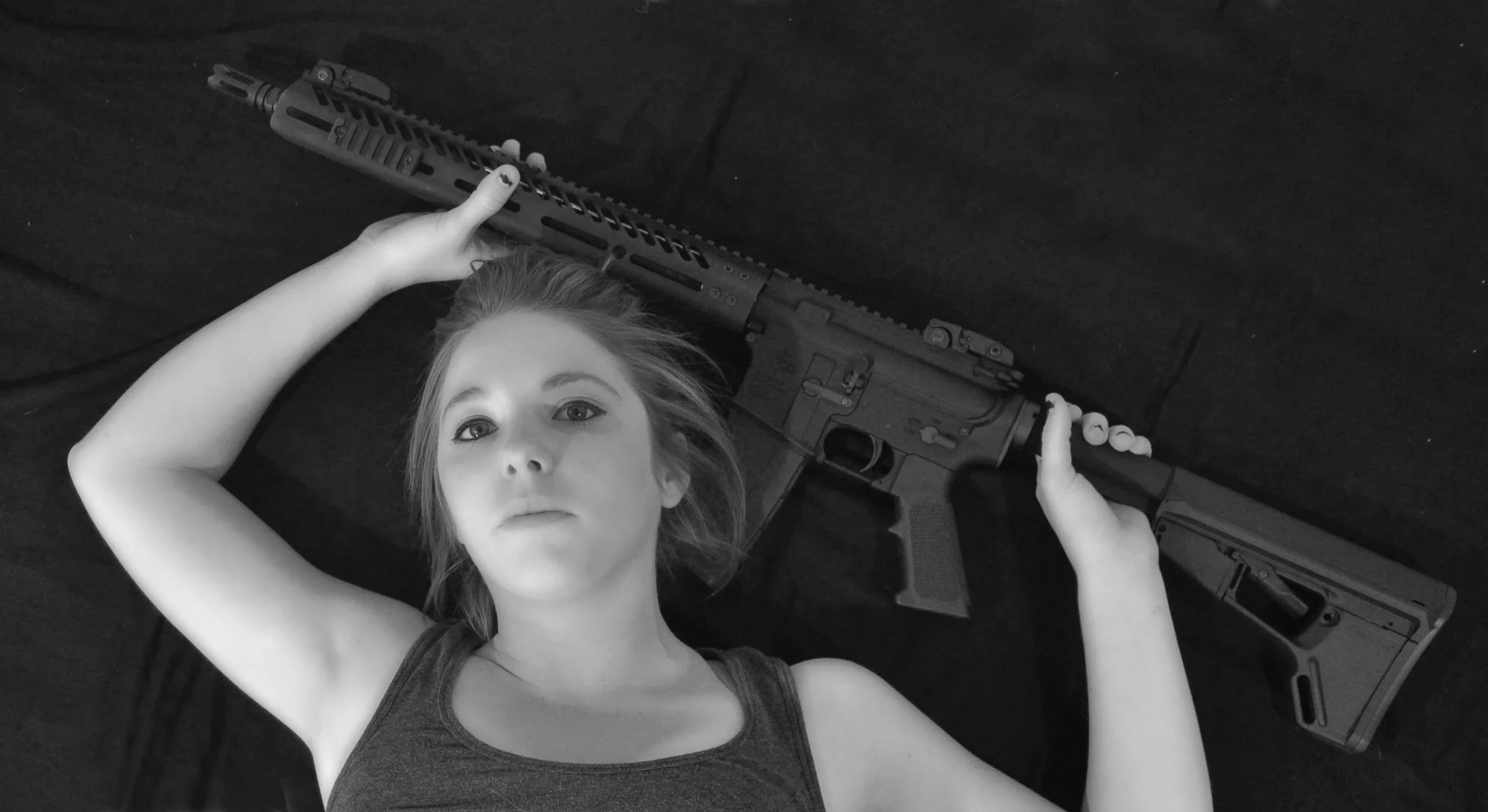 I have included an image of myself. Pictured here is an AR 15 that my husband built. I was asked why this is empowering to me. I have to answer by saying that there is something about standing face on to a target lifting the sights to my eye taking aim and pulling the trigger. The challenge of hitting in the proper place and the ability to look back to a smiling husband. This is only one of many things that make me feel empowered. 