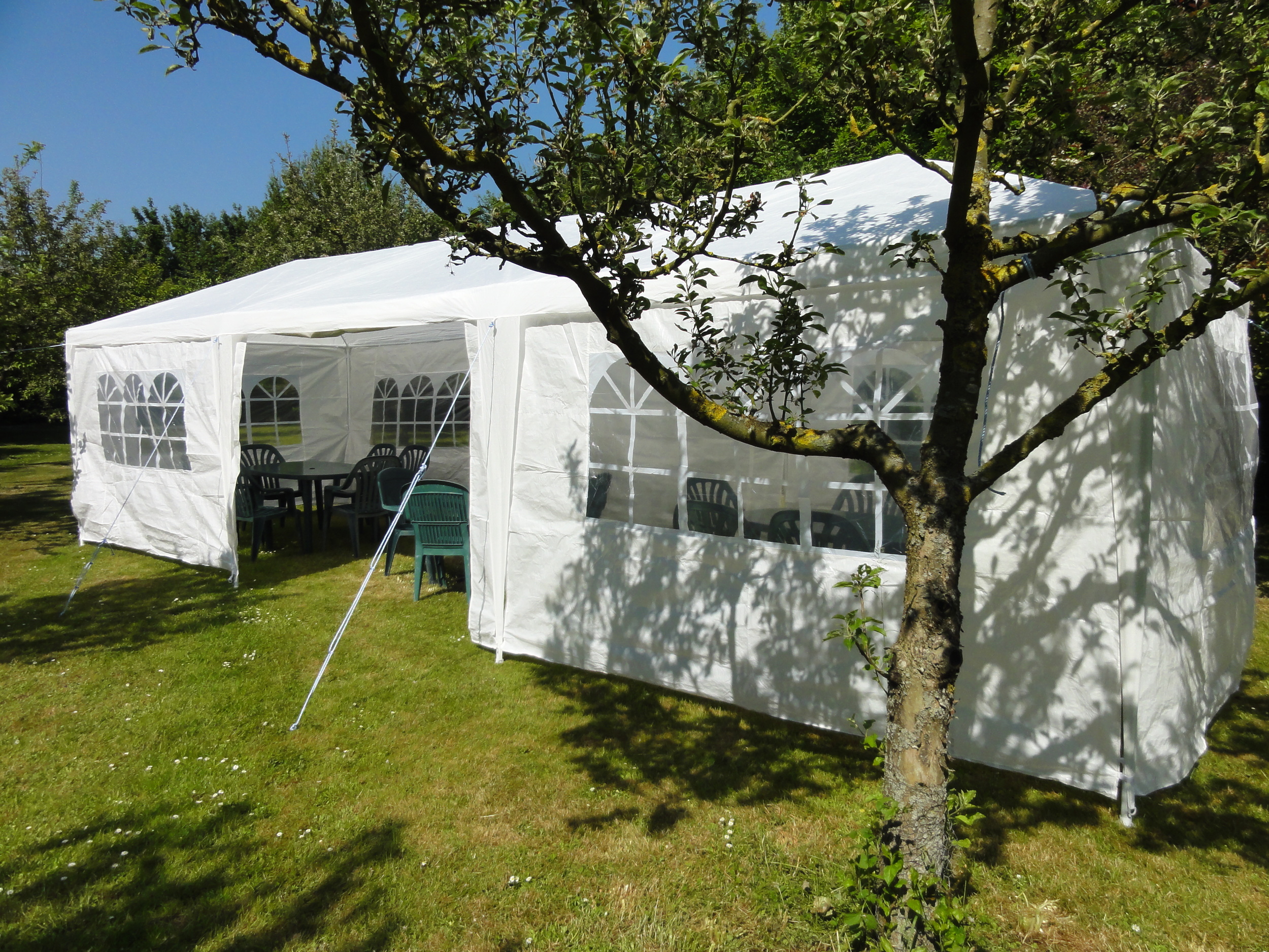Small party marquee set up in the orchard