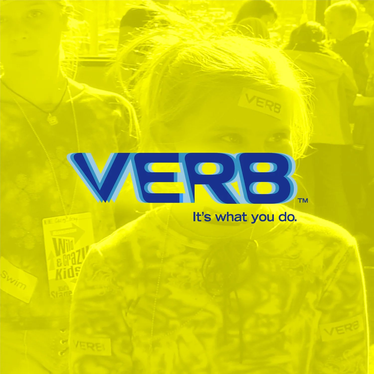 VERB Logo with ghosted event image of two tween girls wearing VERB Lanyards and stickers on their head and shirts
