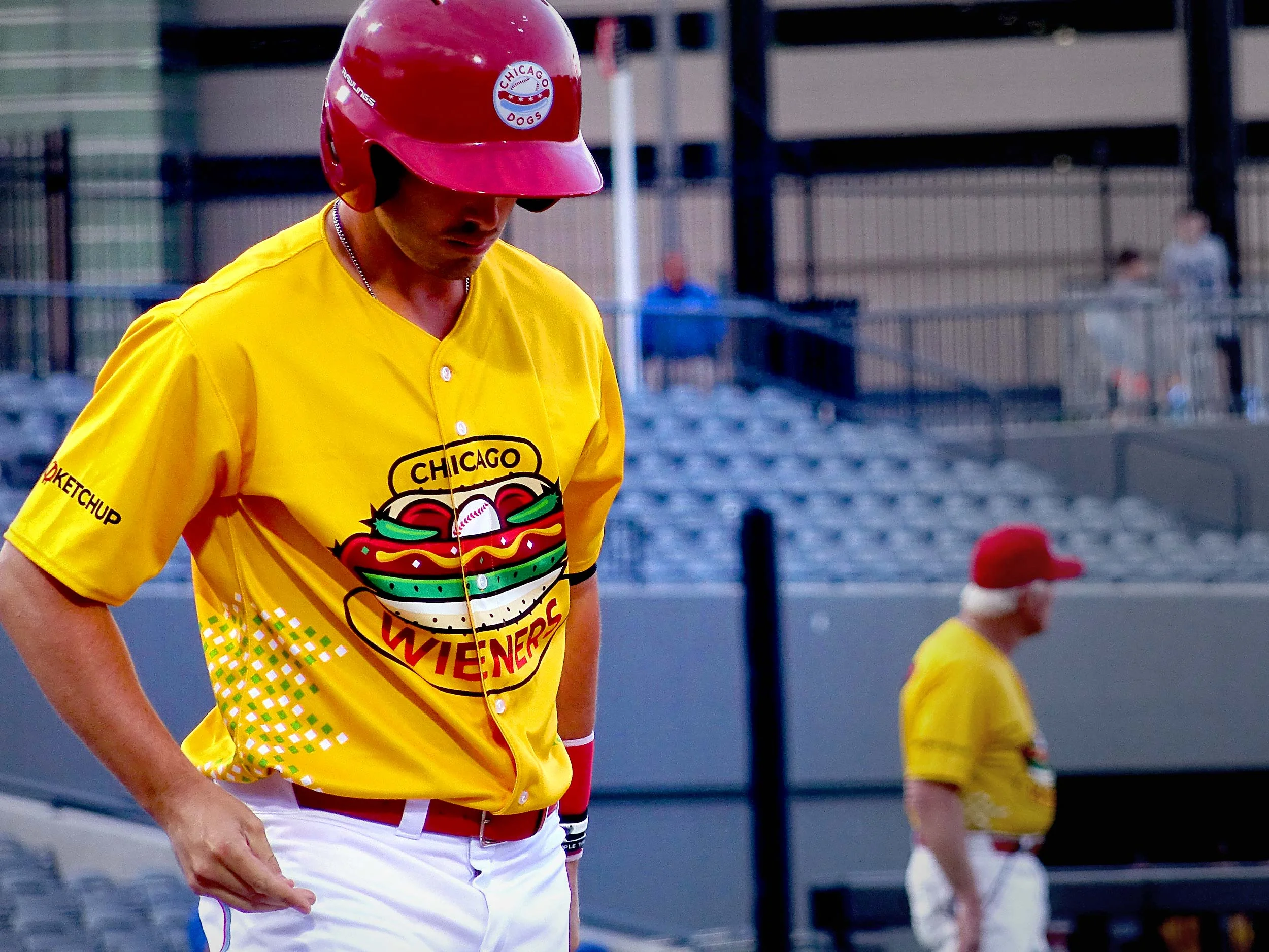 Chicago Wieners InGame Jersey worn by a Chicago Dogs player and general manager in the background