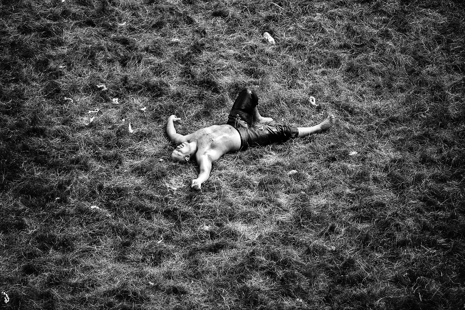 Oil Wrestler Down on a Field