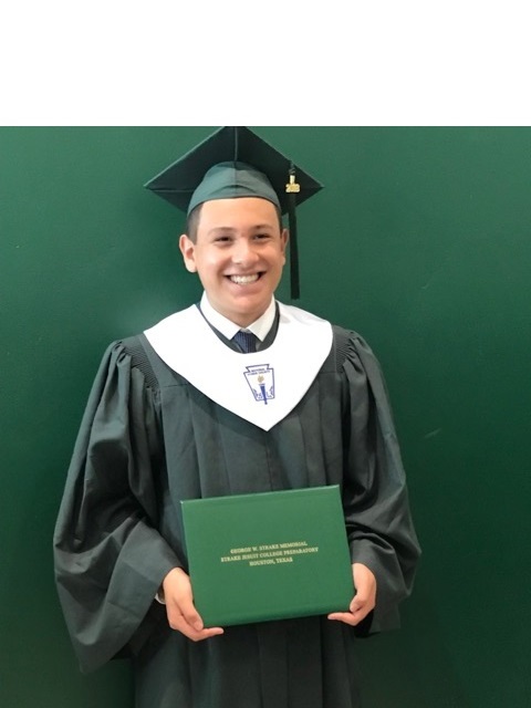 Carlos at SJ Graduation in Cap and Gown.jpeg
