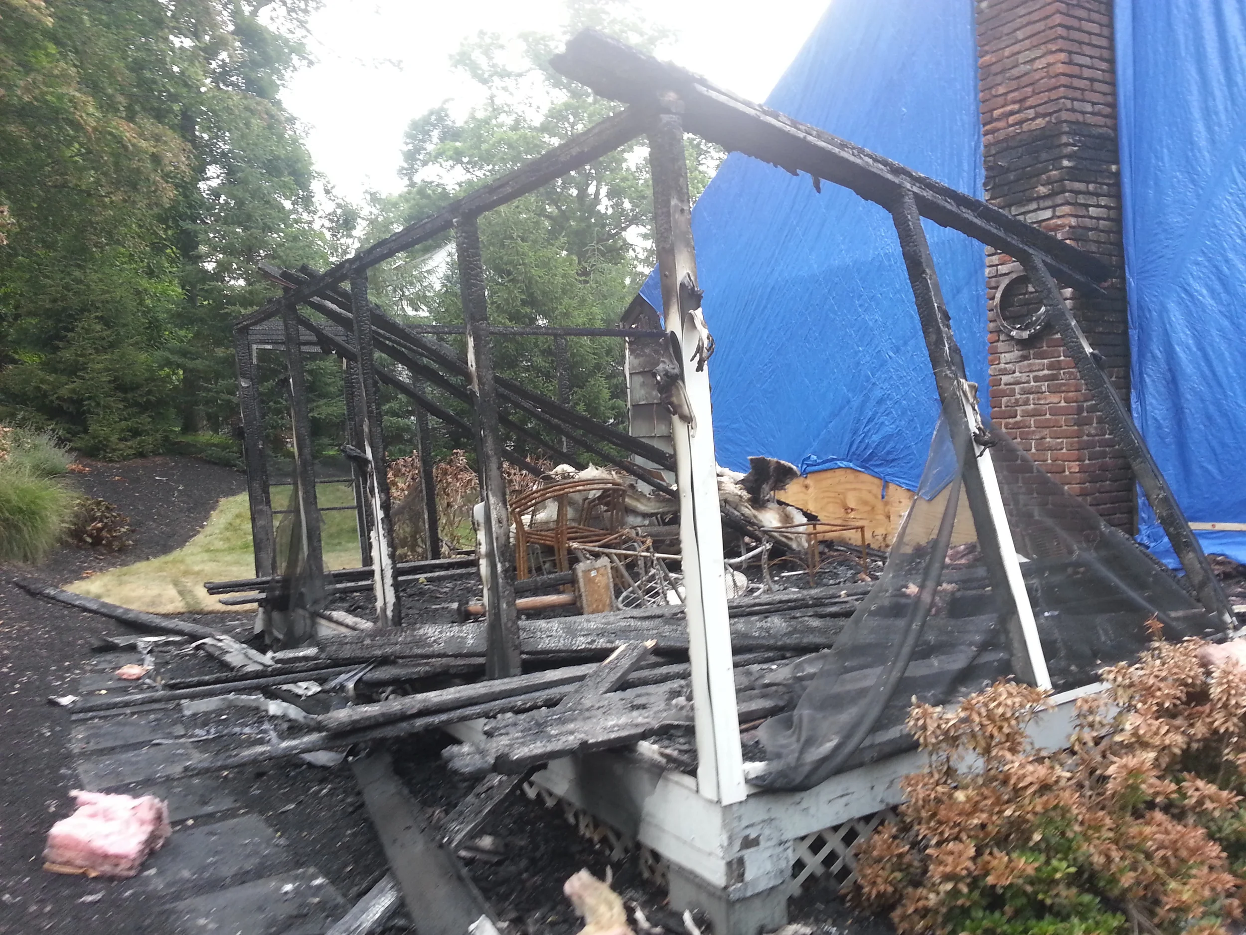 Fire damaged exterior before restoration by Groundswell Contracting