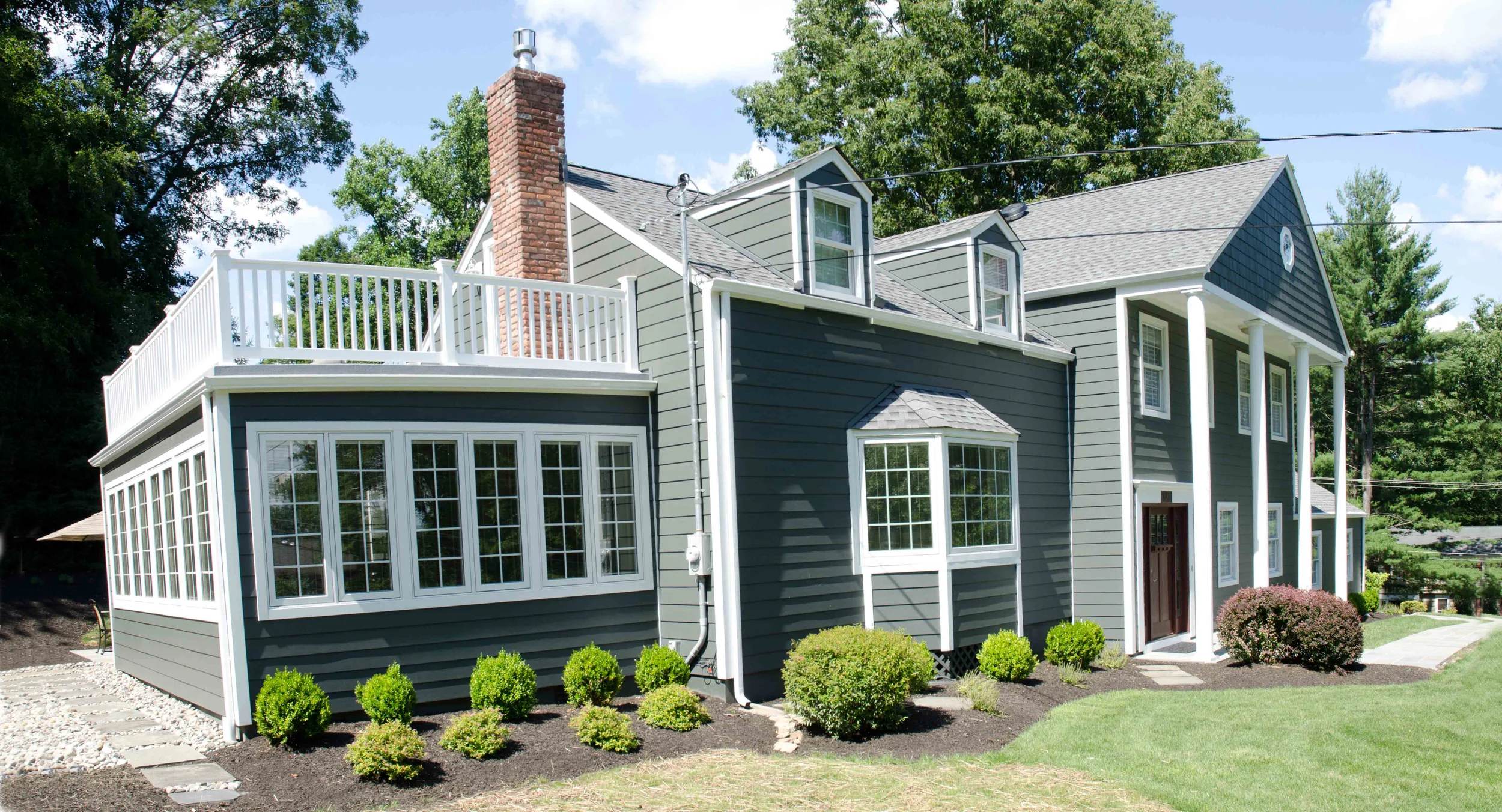 Fire damaged exterior after restoration by Groundswell Contracting