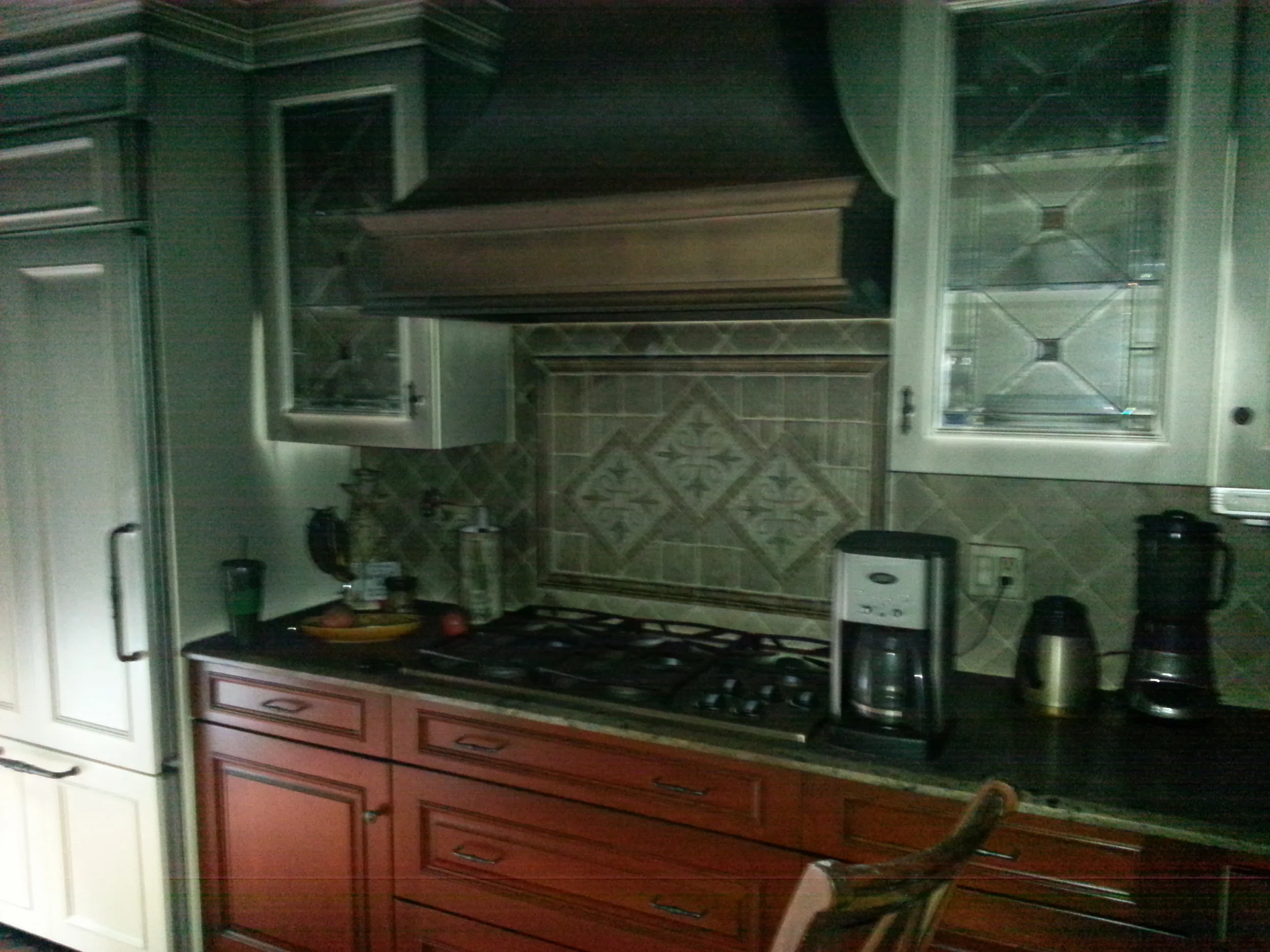 Fire and smoke damaged Wood Mode kitchen before restoration by Groundswell Contracting