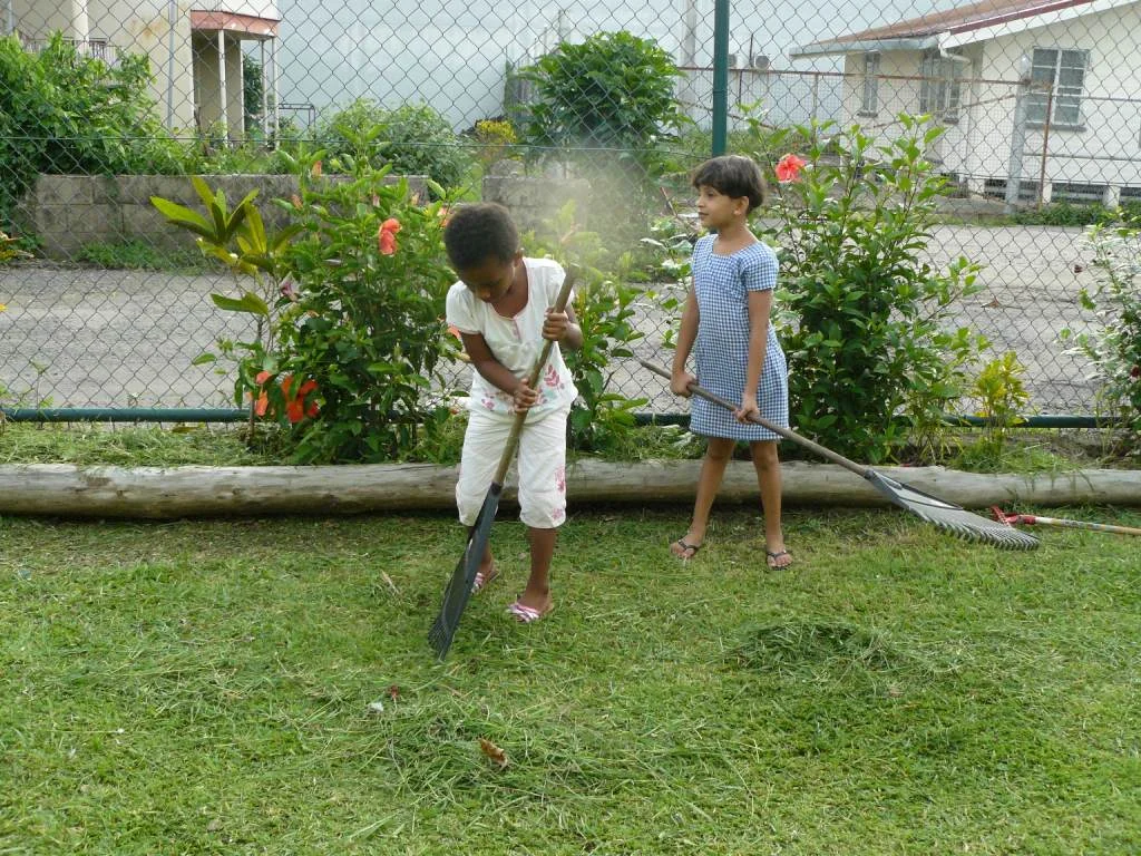 chn learning about keeping their environment clean.JPG