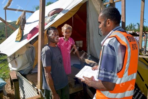 Empower Pacific's senior counsellor Harrison Kautoga, right, talks to the turaga-ni-koro, Penasio Waqa, and his daughter Karalaini Natabua at Navuniyaumunu Village in Ra during a counselling sesson. Picture: JAI PRASAD