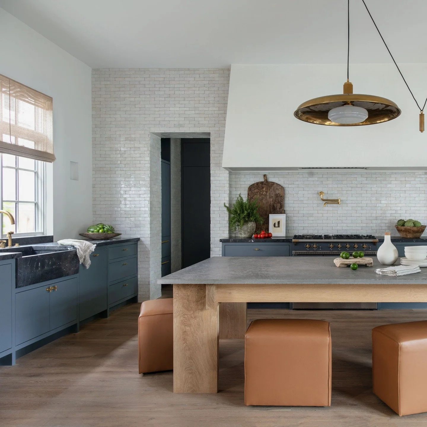A bit of a throwback picture of the kitchen of our Dryden project. 
Oversized plaster hood, integrated stone sink, backsplash wall of zellege tile, custom designed and built furniture island. 

Beautifully designed by @jilleganinteriors, architectual