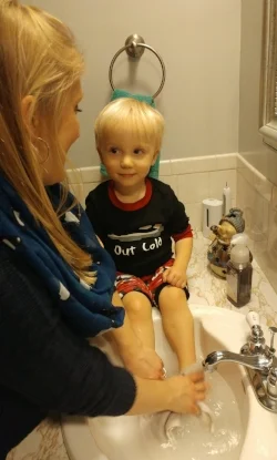washing feet in sink.jpg