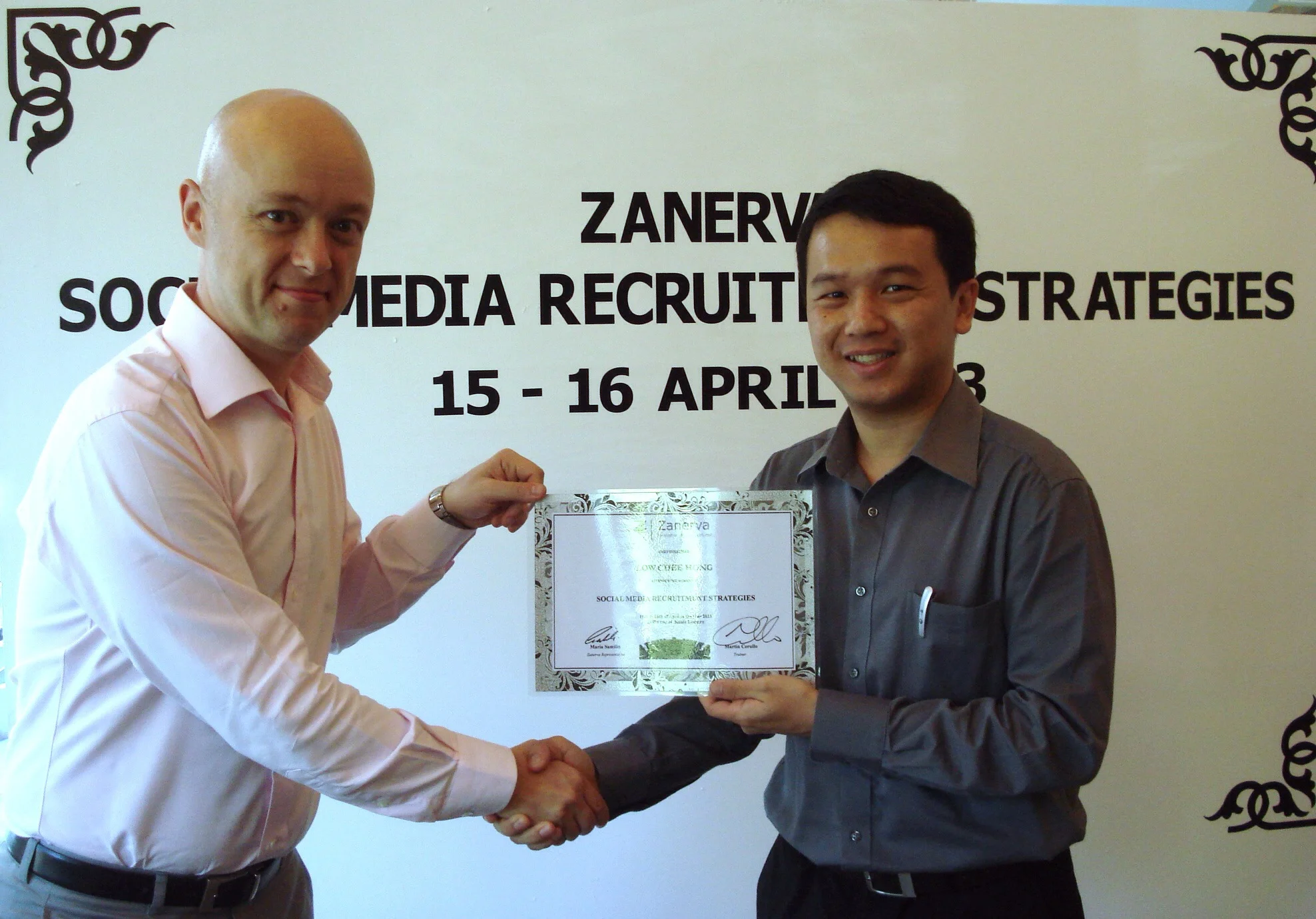 Low Chee Hong, Group Human Resource Executive at BMW Malaysia receiving his certificate of participation for attending the Social Media Recruitment Strategies Workshop in Kuala Lumpur