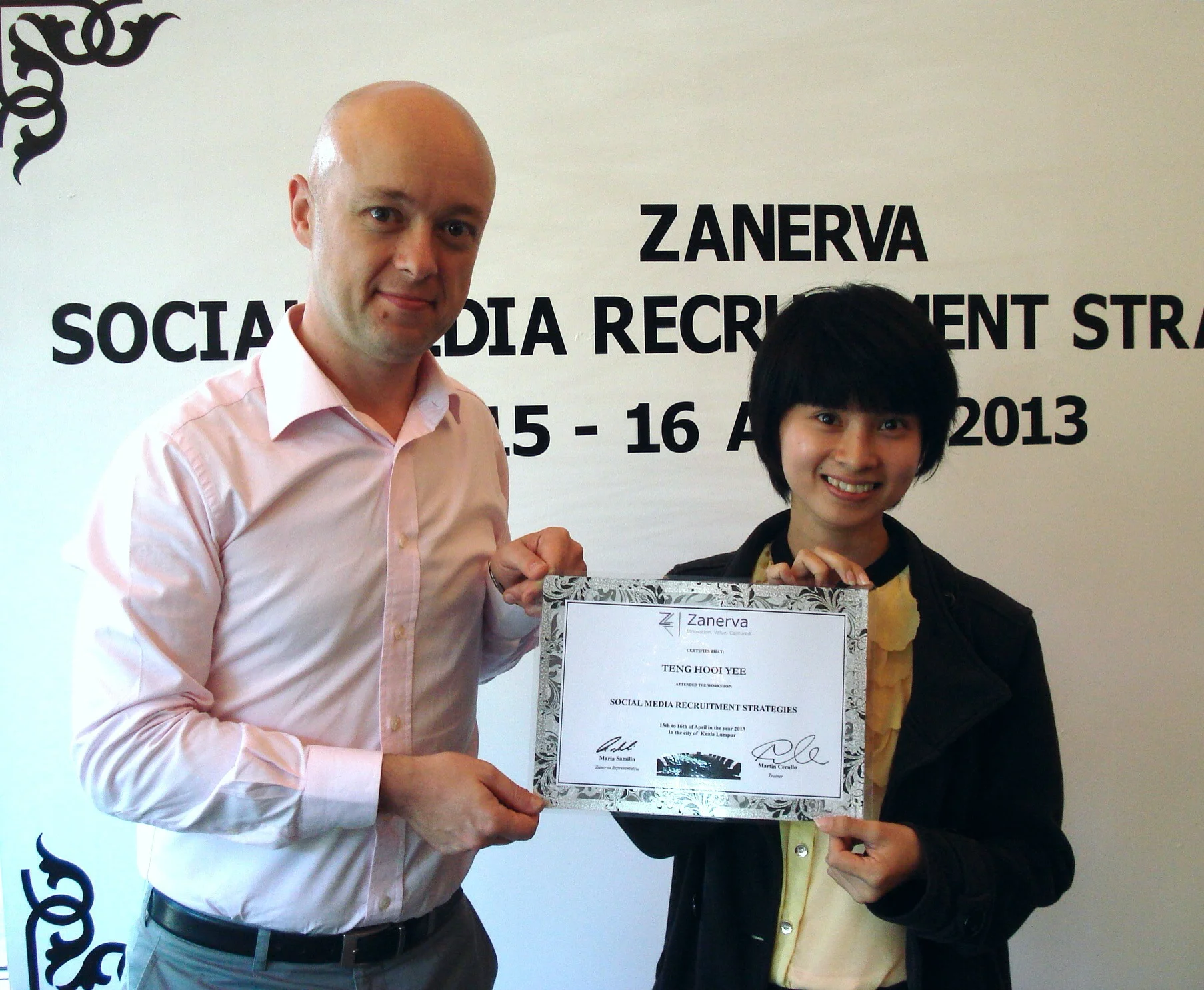 Teng Hooi Yee, Human Resource Executive at Lotte Chemical Titian (M) Sdn Bhd receiving her certificate of participation for attending the Social Media Recruitment Strategies Workshop in Kuala Lumpur