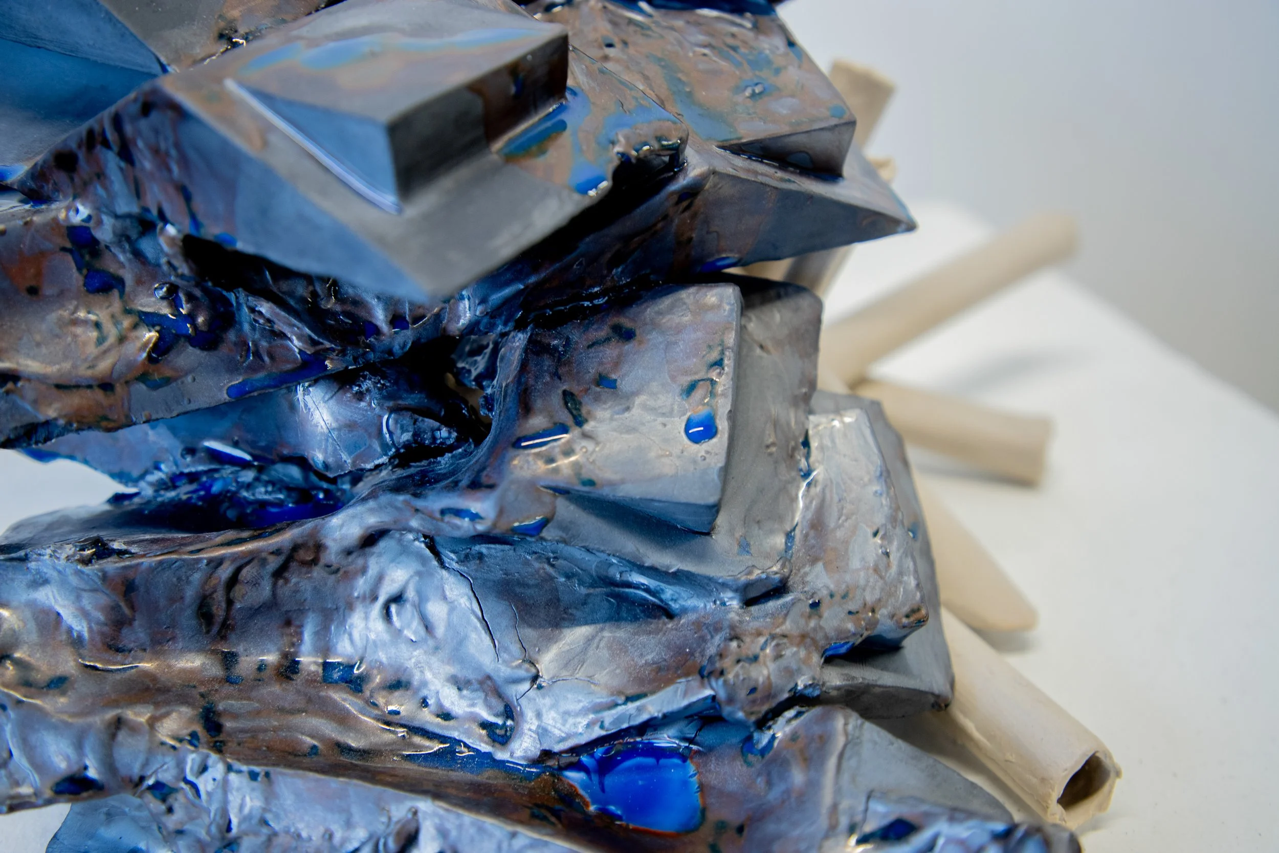 Undercurrent 2025 (Detail)
Black Porcelain, Stoneware, Glaze and Epoxy.
8”H  x 18” W x 13” D