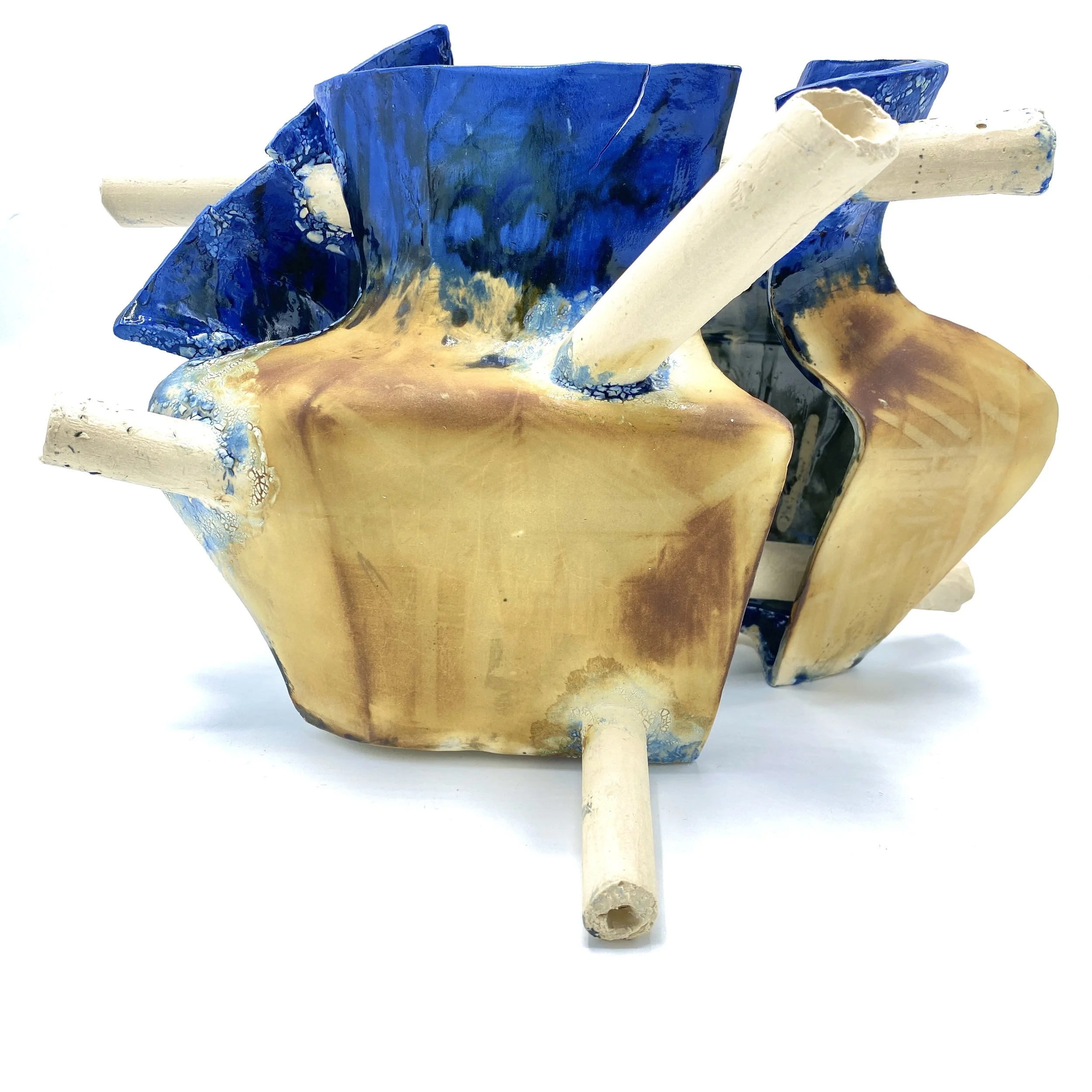Construction/Deconstruction: Reflections on the World No. 5
2025
Slip-cast porcelain, cyanotype photographs, glazes, and wax. 
14”h x 15”w x 12”d 