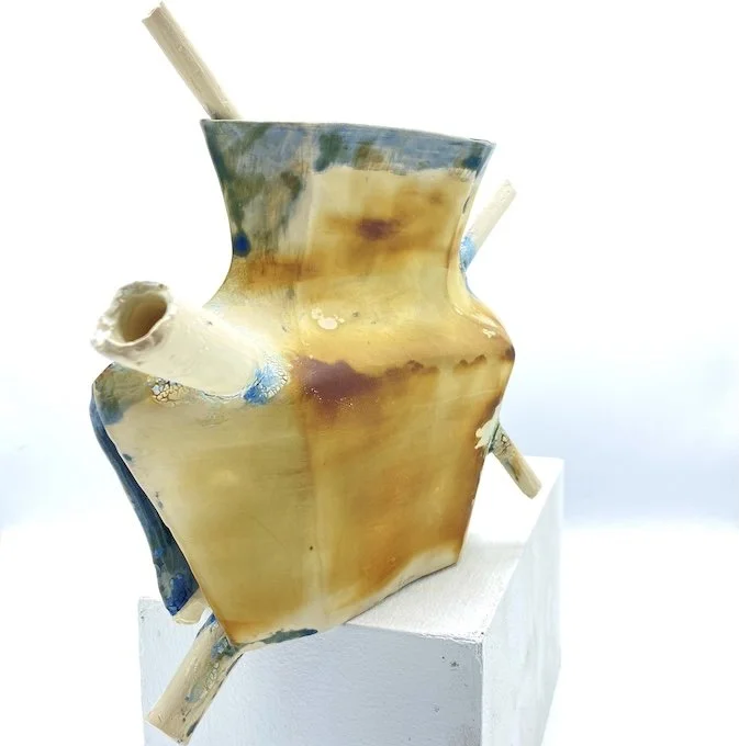Construction - Deconstruction: Reflections on the World,  Vase #4  2025
Cast ceramic form with cyanotype photographs, various glazes, oil, and wax sealant. 
11”h x 14”w x 9”d 